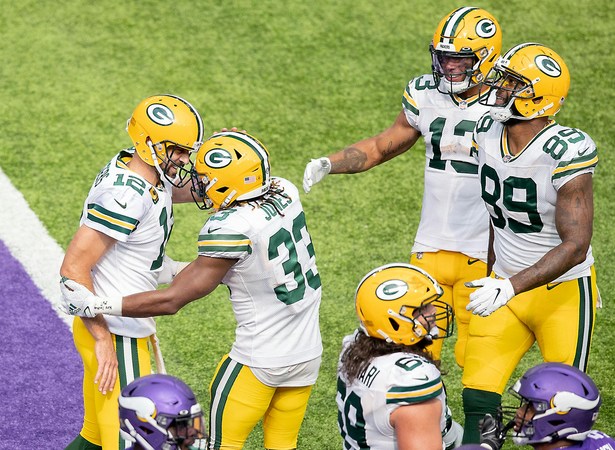 Green Bay Packers quarterback Aaron Rodgers, left, celebrated a touchdown with Green Bay Packers running back Aaron Jones during the fourth quarter.