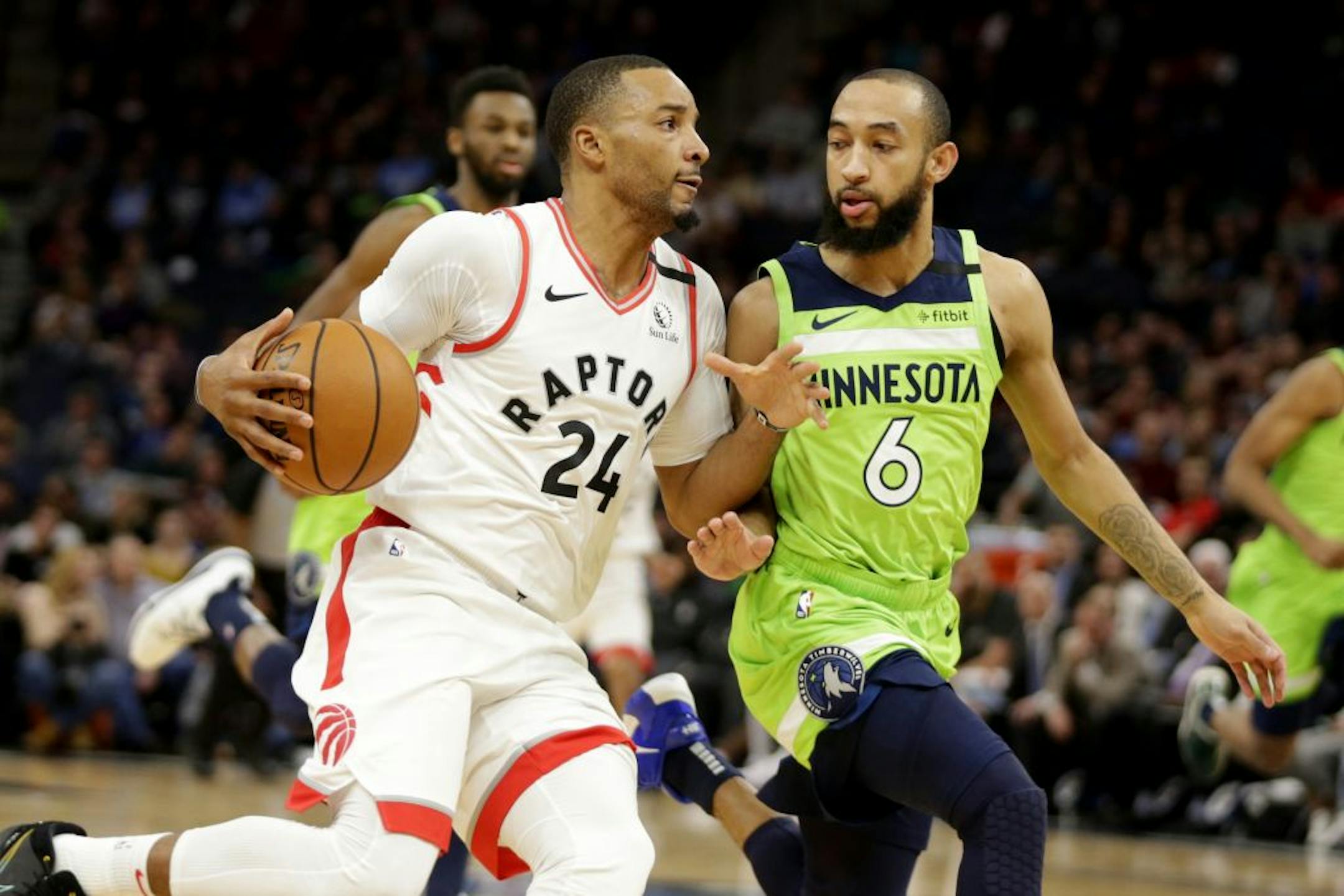 Toronto Raptors guard Norman Powell (24) drives against Minnesota Timberwolves guard Jordan McLaughlin (6) in the third quarter of an NBA basketball game Saturday, Jan. 18, 2020, in Minneapolis.