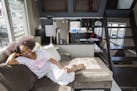 Austene Van relaxes in the main living area of her recently remodeled houseboat.