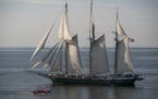 Sandy Hoff drove his jeep boat past the schooner Denis Sullivan out of Milwaukee so his passenger, Kerry Leider, could get a photo. The sailing vessel