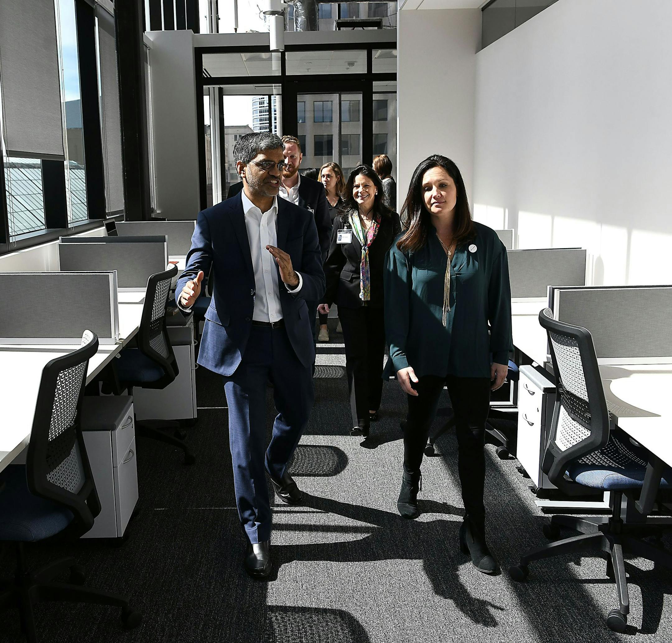 Mahesh Ramanujam, president and chief executive of the U.S. Green Building Council, gets a tour of the LEED-certified 428 building with Jamie Rissi, operations manager for the building's Wellworth co-working space.
Photo by Jim Bovin