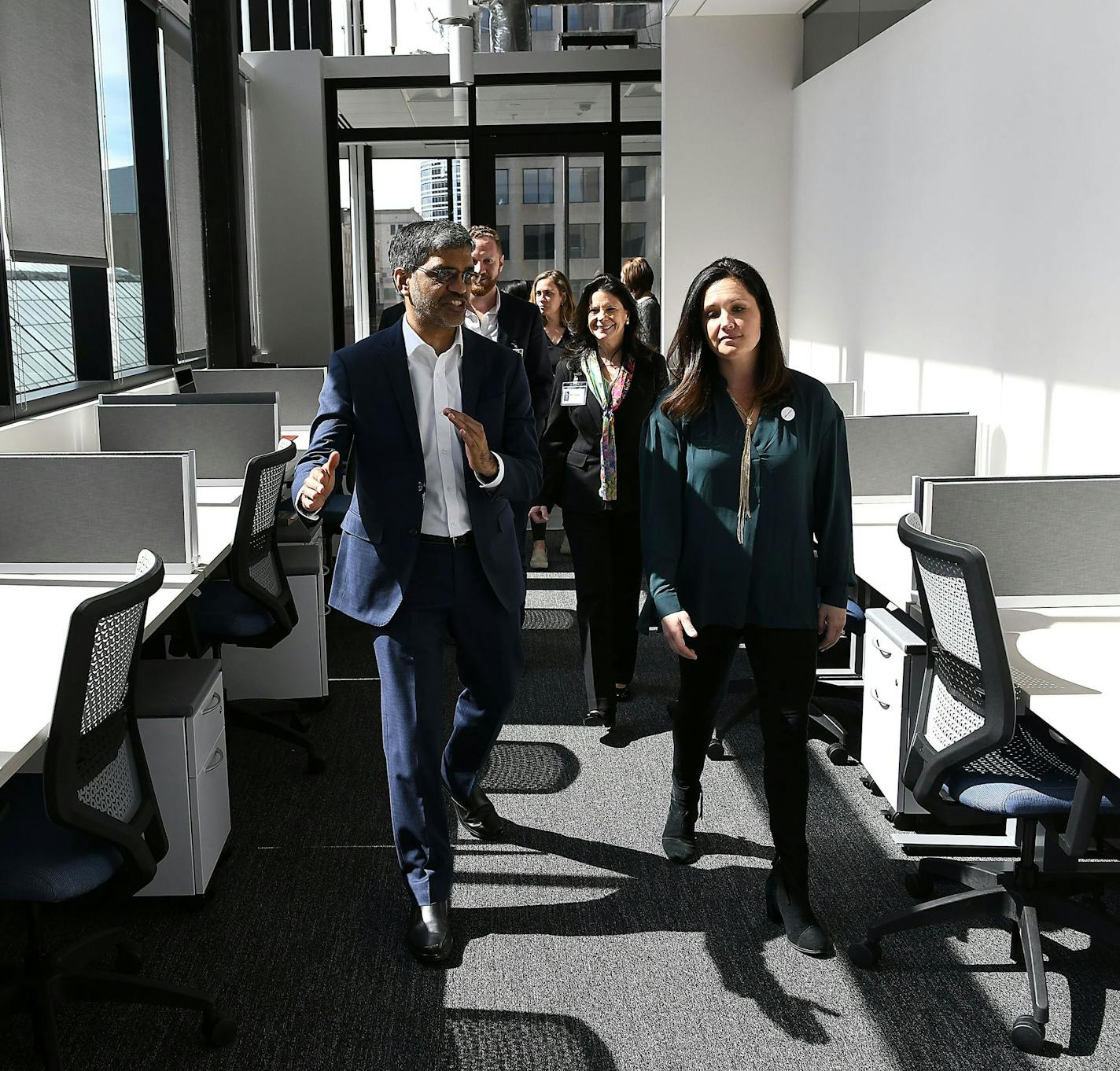 Mahesh Ramanujam, president and chief executive of the U.S. Green Building Council, gets a tour of the LEED-certified 428 building with Jamie Rissi, operations manager for the building's Wellworth co-working space.
Photo by Jim Bovin