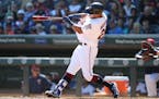 Minnesota Twins left fielder Eddie Rosario follows through with a solo homer in the second inning at Target Field on Sunday