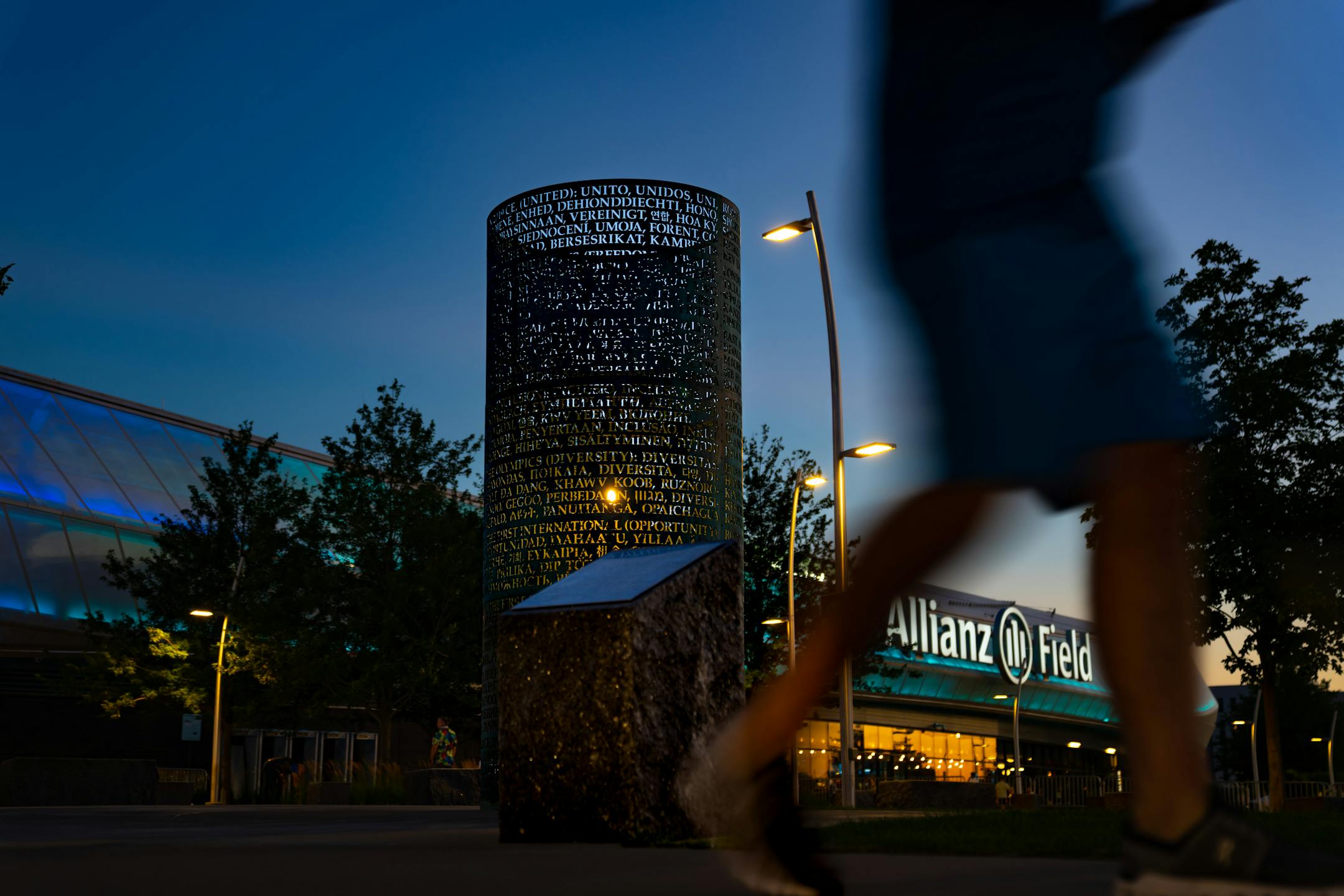 Fans file out of Allianz Stadium after a Loons win against Everton, Wednesday, July 20, 2022, St. Paul, Minn. The OMNIS sculpture by artist Jim Sanborn is located at the north side of Allianz Stadium. It is a cylindrical bronze work with text about the values of soccer written in 80 or so languages; at night, the sculpture lights up from the inside and projects text onto the ground and nearby buildings. The piece was commissioned by Bill McGuire, owner of Minnesota United and former CEO of UnitedHealthcare. ] GLEN STUBBE • glen.stubbe@startribune.com