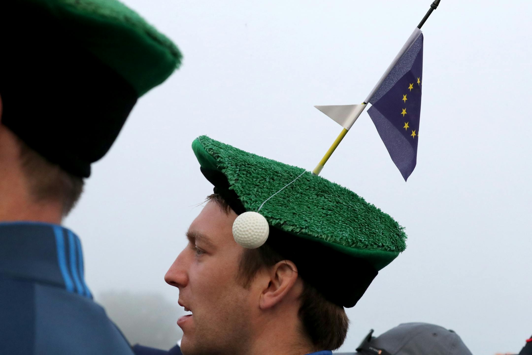 Oliver Pell, of London, watches the action at the first tee.