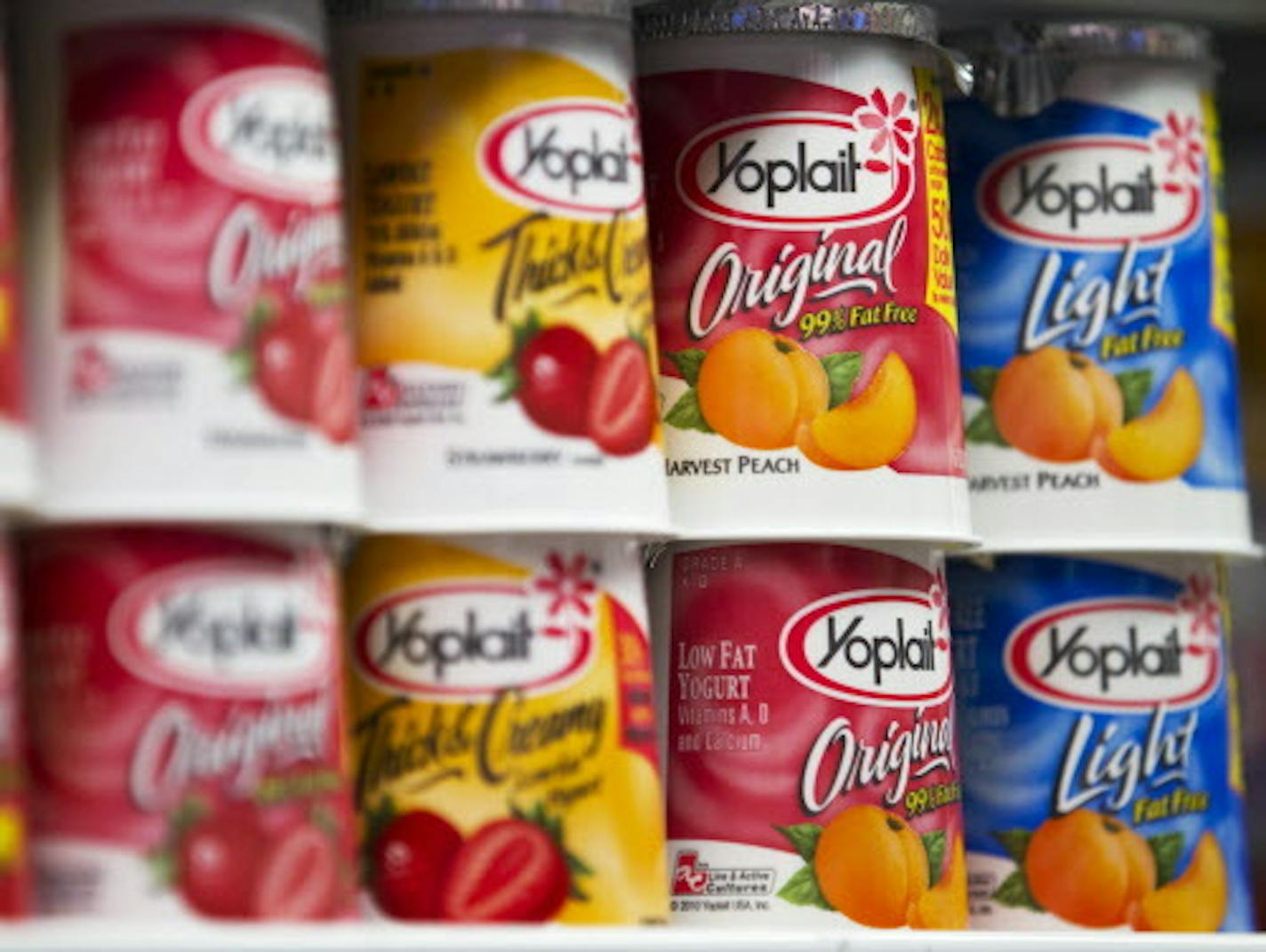 Yoplait yogurt is displayed on the shelf at a supermarket in New York, U.S., on Friday, March 18, 2011. General Mills Inc., the maker of Cheerios cereal, is in exclusive talks to buy 50 percent of Yoplait, strengthening ties to the French yogurt maker to expand its line of dairy products.