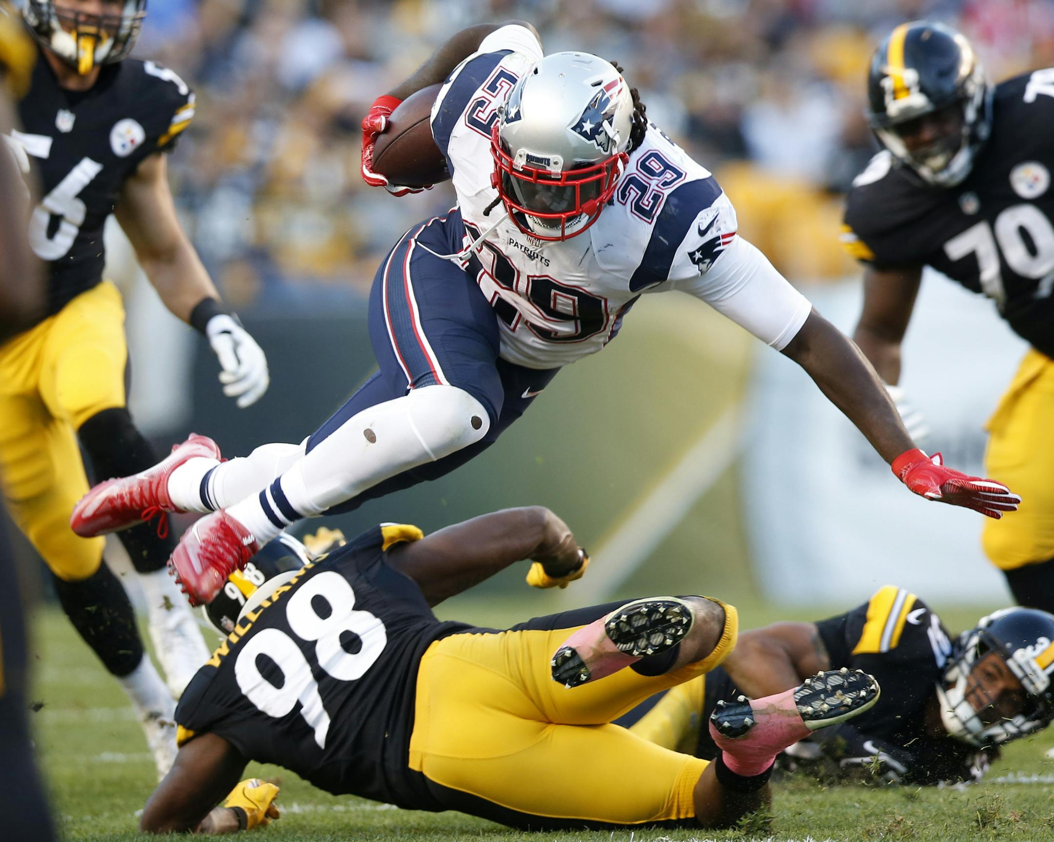 New England Patriots running back LeGarrette Blount (29) is upended by Pittsburgh Steelers inside linebacker Vince Williams (98) during the first half of an NFL football game in Pittsburgh, Sunday, Oct. 23, 2016. (AP Photo/Jared Wickerham)