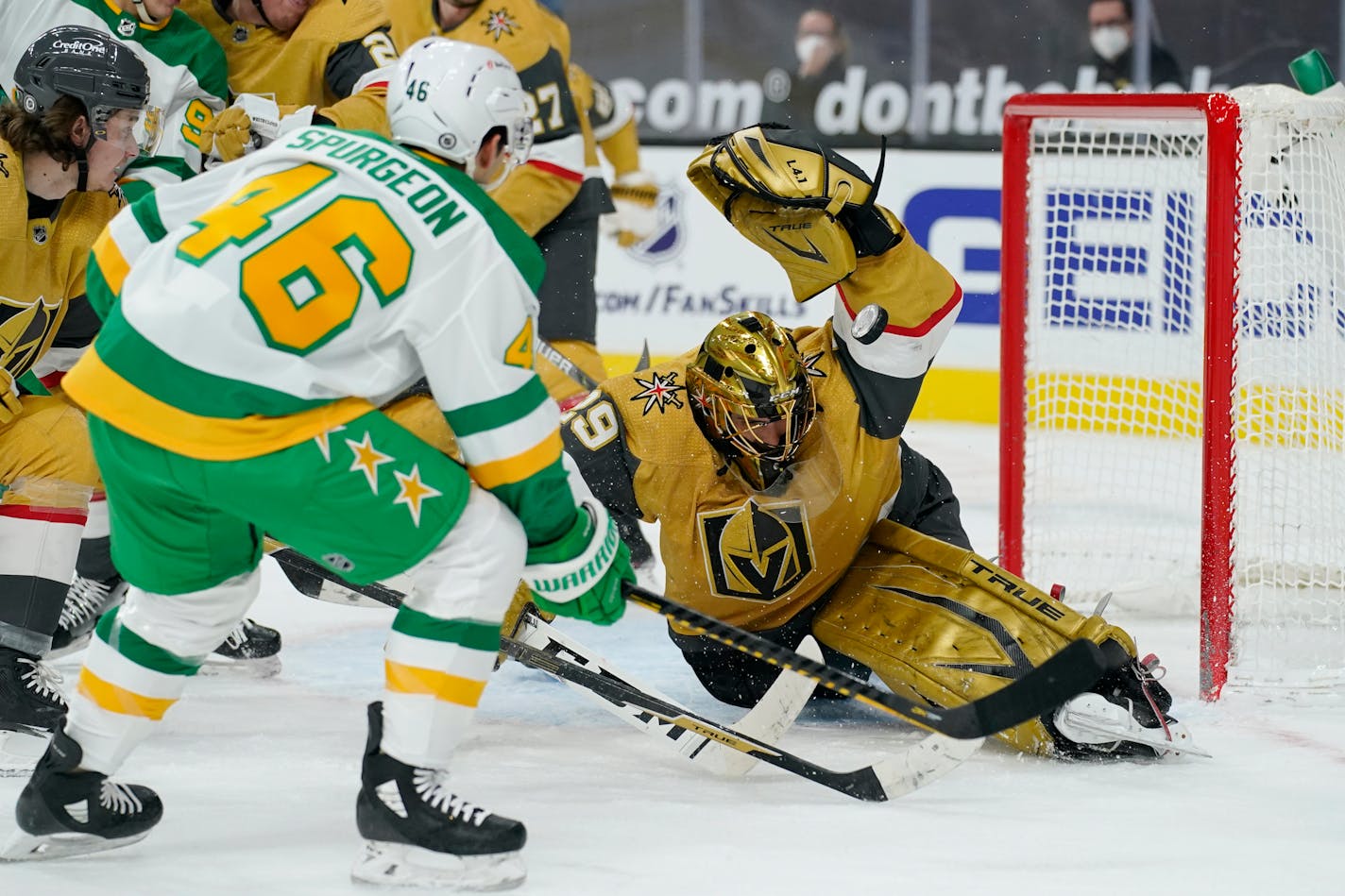 Vegas Golden Knights goaltender Marc-Andre Fleury blocks a shot by Wild defenseman Jared Spurgeon during the first period