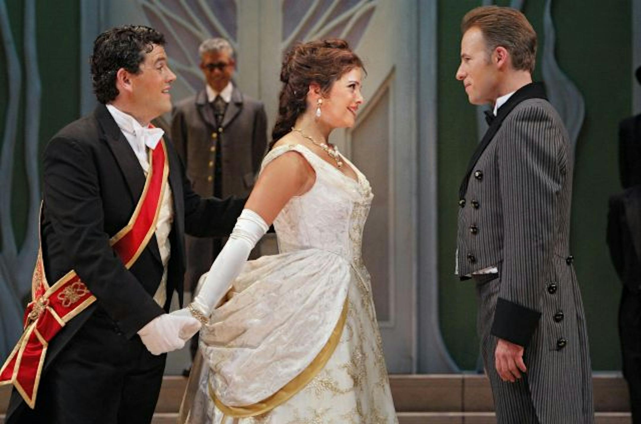 Andrew Wilkowske as Dandini, Daniel Mobbs as Alidoro, Roxana Constantinescu as La Cenerentola (Angelina) and John Tessier as Don Ramiro in The Minnesota Opera production of "Cinderella (La Cenerentola)."