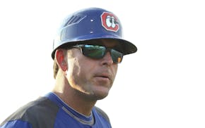 Photo by Dan Henry - Chattanooga Lookouts staff manager Doug Mientkiewicz #16 works with his team as they play the Biloxi Shuckers at AT&T Field in Ch