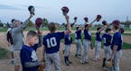 Members of the Bulldogs tipped their hats at the end of the gam during their summer baseball season.