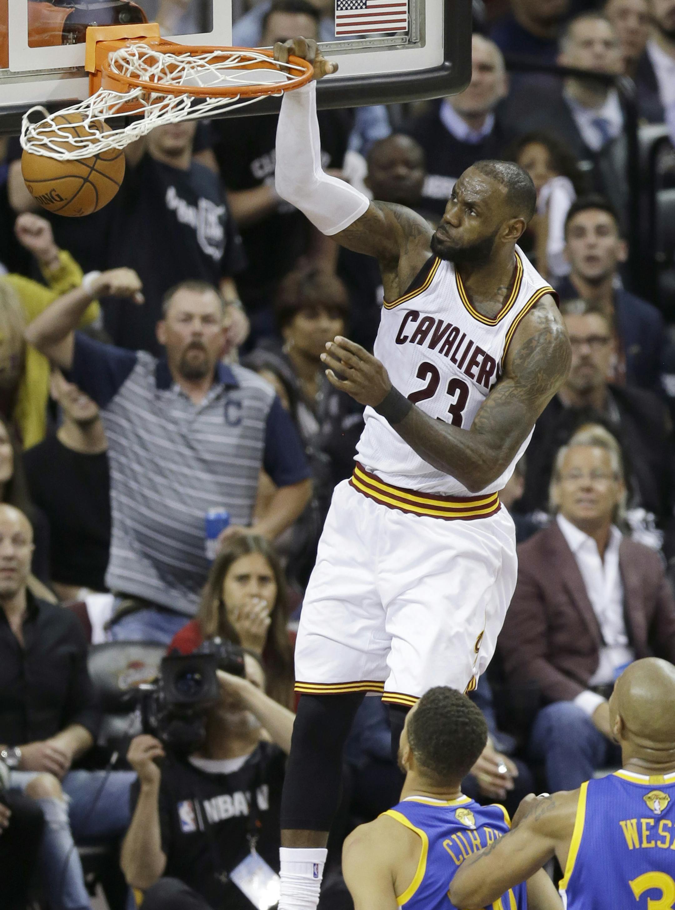 Cleveland Cavaliers forward LeBron James (23) dunks against the Golden State Warriors during the first half of Game 4 of basketball's NBA Finals in Cleveland, Friday, June 9, 2017. (AP Photo/Tony Dejak)