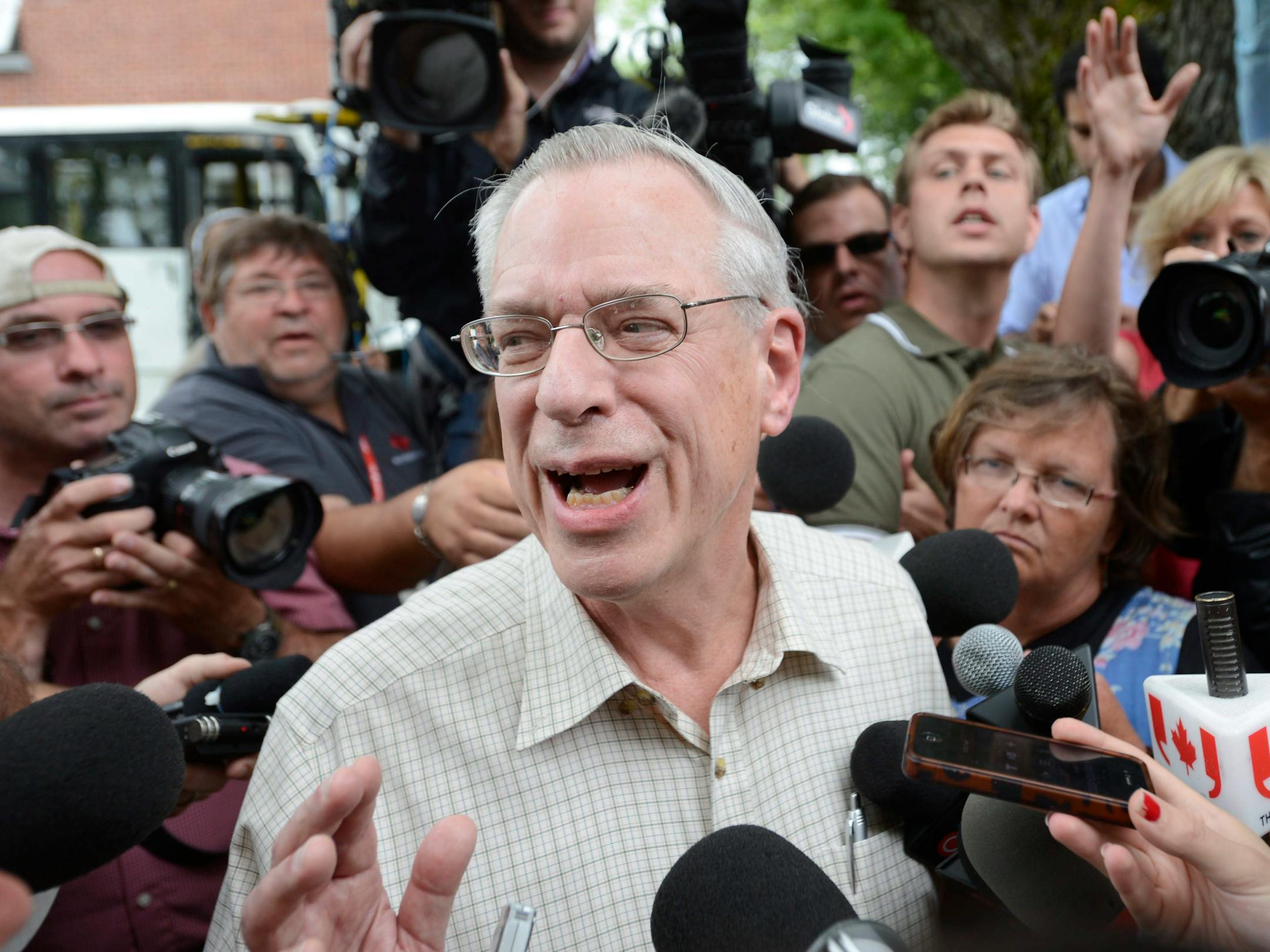 Rail World Inc. President Edward Burkhardt speaks to the media as he tours Lac-Megantic, Quebec, on Wednesday, July 10, 2013. Burkhardt said Wednesday that an employee failed to properly set the brakes of the train that crashed into a town in Quebec, killing at least 15 people. (AP Photo/ The Canadian Press, Ryan Remiorz)