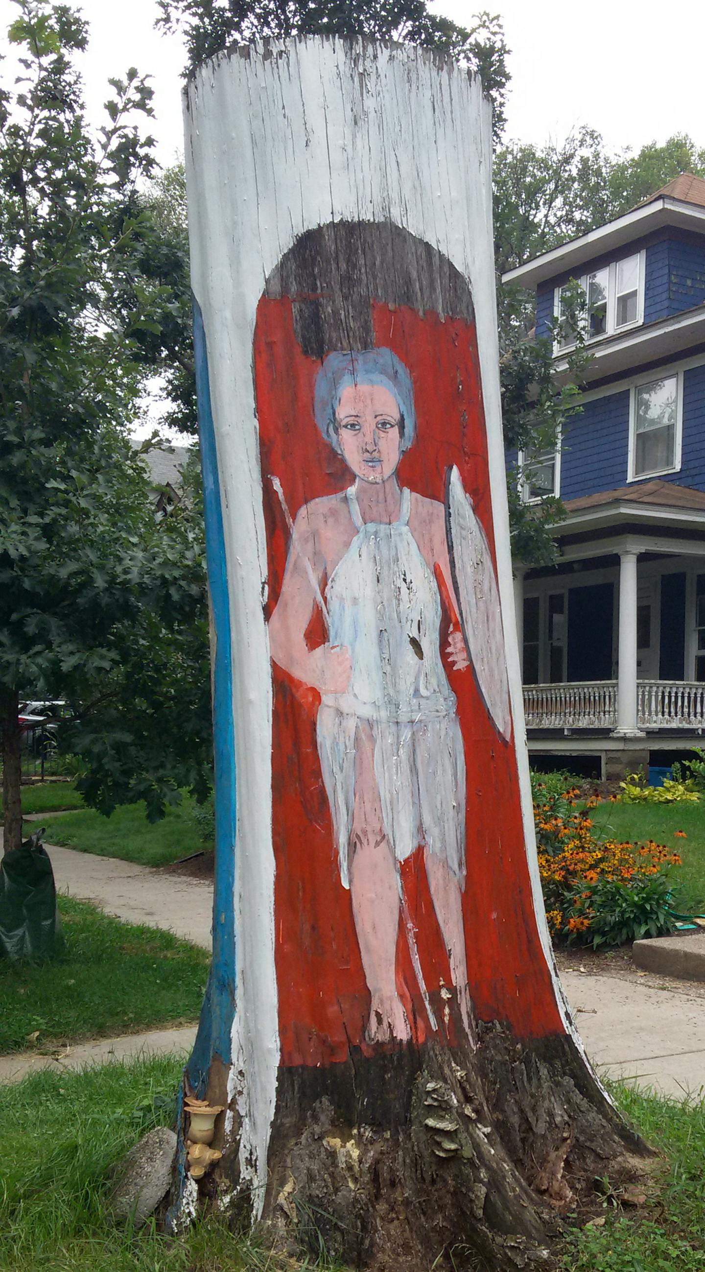 Hend Al-Mansour had three figures painted on the tree trunk that once stood in front of her home in the Union Park area of St. Paul, including one that upheld the Hand of Fatima to dispel the evil eye.]RichardTsong-Taatarii richard.tsong-taatarii@startribune.com