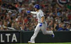 Kansas City Royals third baseman Cheslor Cuthbert (19) celebrated his 2-run home run in the top of the ninth inning, bringing home shortstop Erick Mej