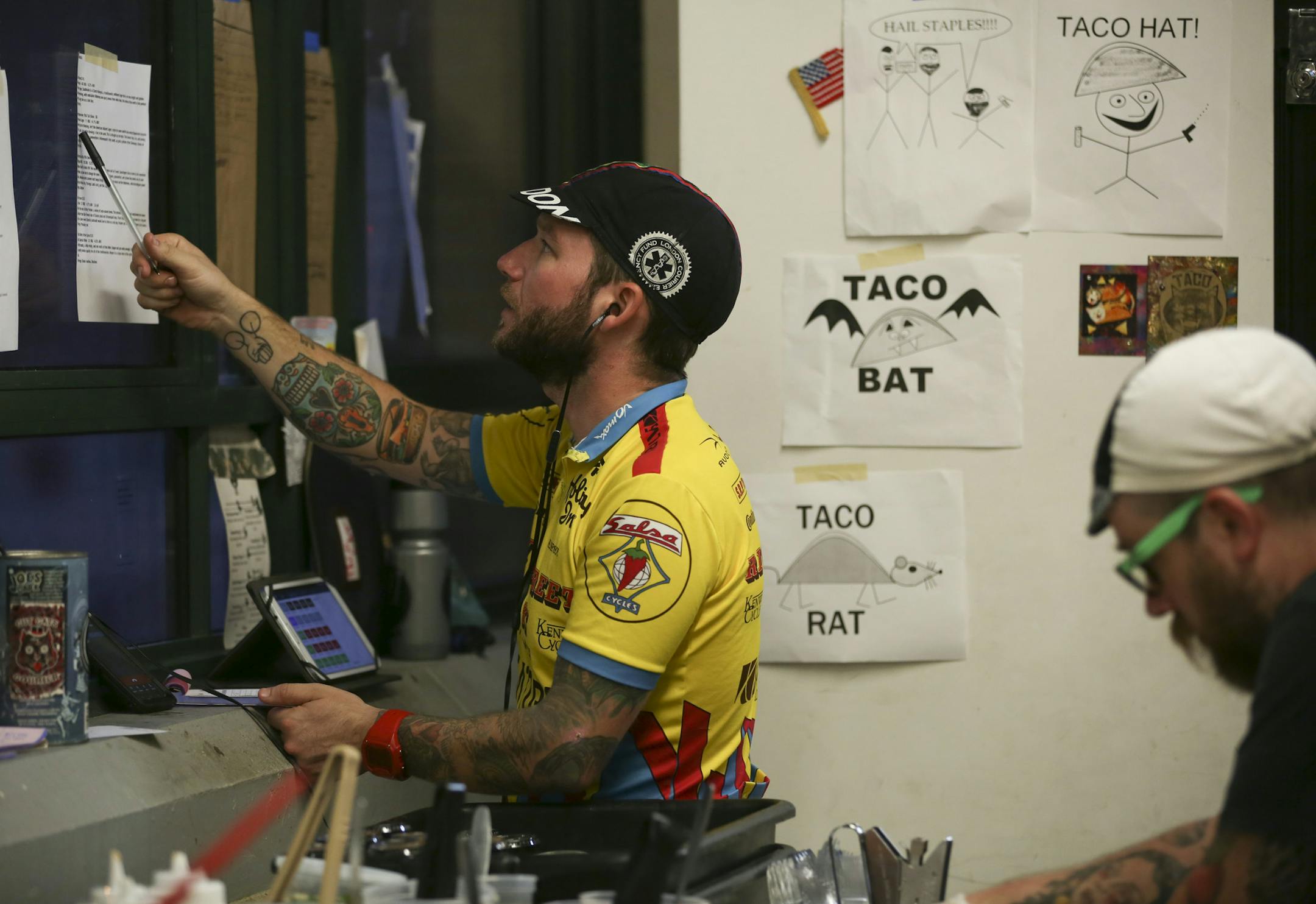 Jeff O'Neill took an order for tacos from a customer over the phone in the kitchen of Taco Cat in the Midtown Global Market Thursday night in Minneapolis. ] JEFF WHEELER ï jeff.wheeler@startribune.com Digital document delivery hasn't completely eliminated the career of the bike messenger, but the numbers of people making a living at it are fewer. Jeff O'Neill is one of three bike messengers working for Metro Legal Services in downtown Minneapolis. He was photographed Thursday evening, Augus