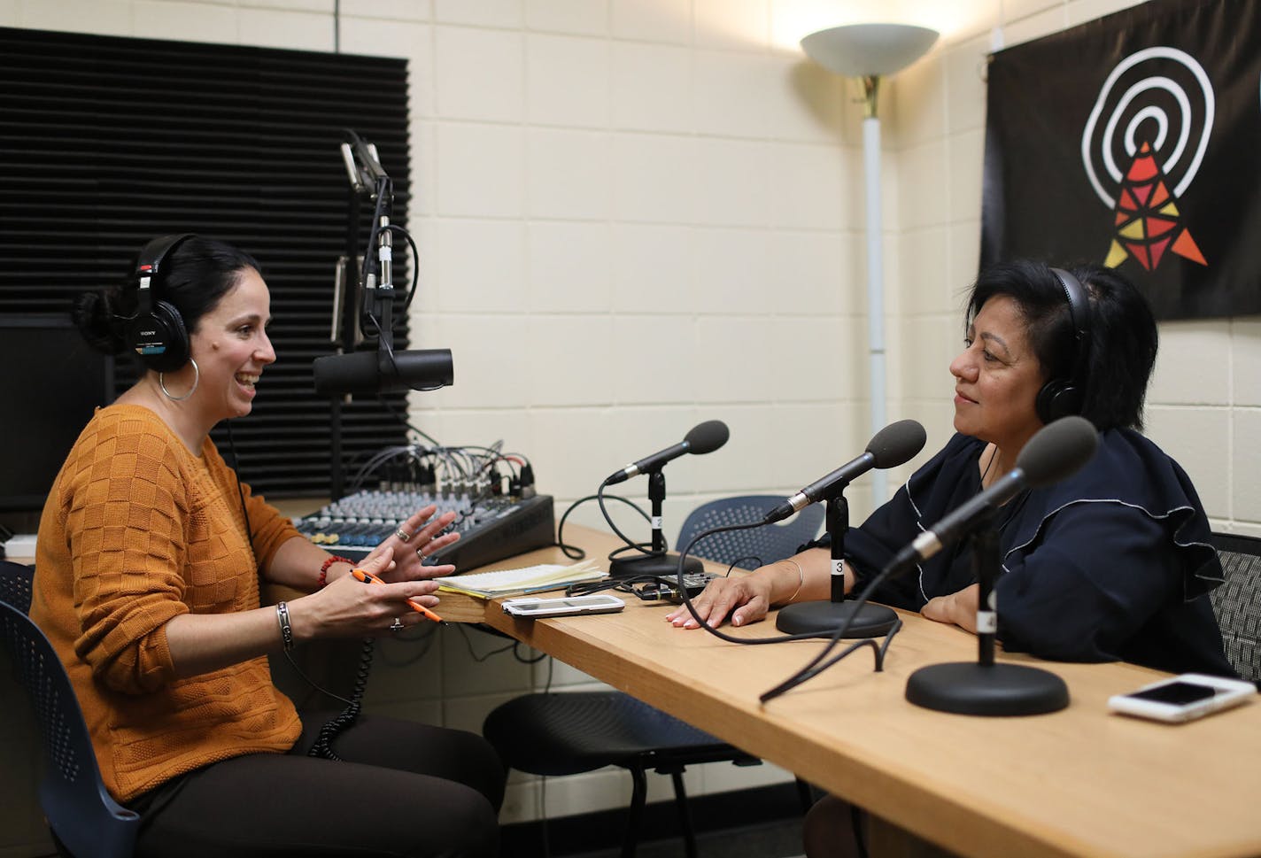 Pillsbury United Communities operates a radio station, KRSM, out of the Wait House in the Phillips Community Center, Here, Briana Santoscoy, left, host of a Spanish language show called Education in Power, spoke with guest Elia Dimayuga-Bruggeman, special assistant to the Commissioner at the Minnesota Department of Education, where they spoke about finding success and navigating the educational system for Latinos during her show Wednesday, June 27, 2018, in Minneapolis, MN.] DAVID JOLES &#xef; d