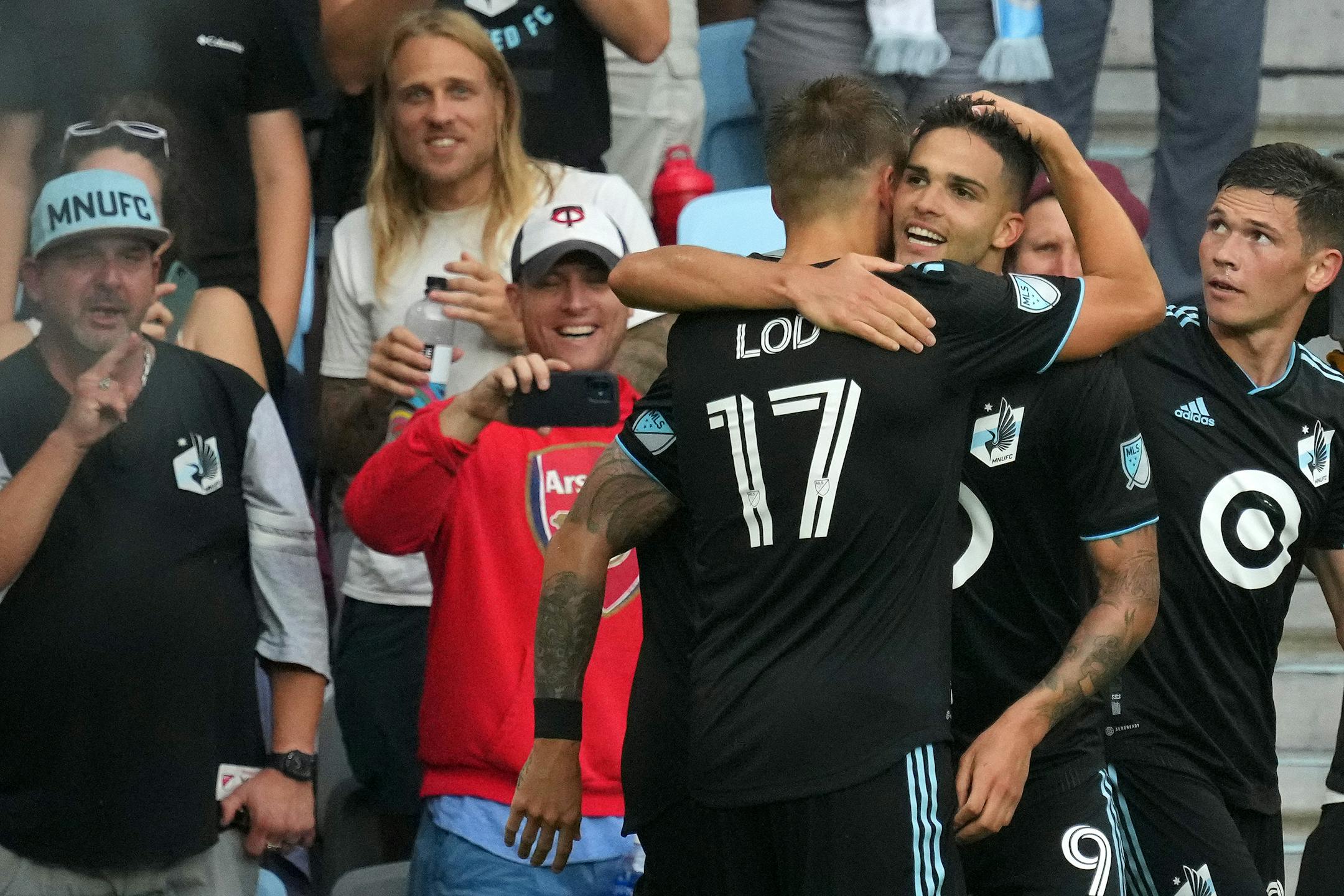 Minnesota United forward Luis Amarilla (9) is congratulated by midfielder Robin Lod (17) after scoring on Houston Dynamo goalkeeper Steve Clark (12) in the second half of an MLS game between Minnesota United and the Houston Dynamo.