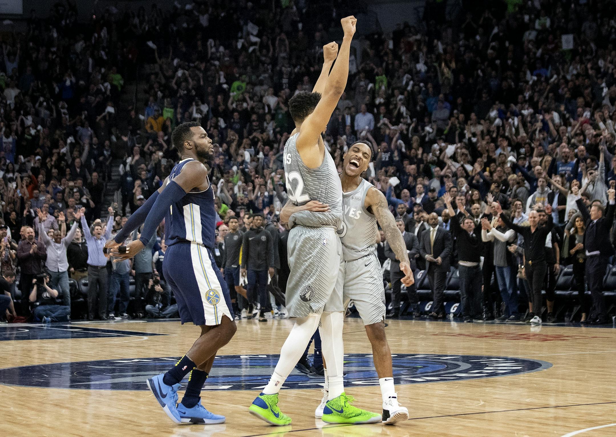 Minnesota Timberwolves Karl-Anthony Towns and Jeff Teague celebrated at the end of Wednesday night's game that clinched a spot in the NBA playoffs.