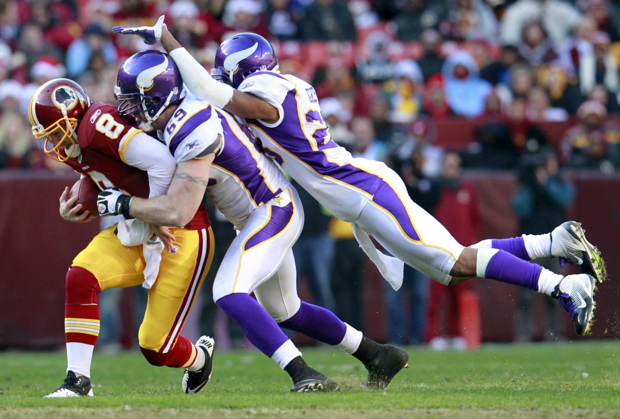 Jared Allen (69) sacks Rex Grossman.