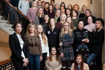 Women who were victims of sexual assault pose for a photo together at the state Capitol in St. Paul in December.