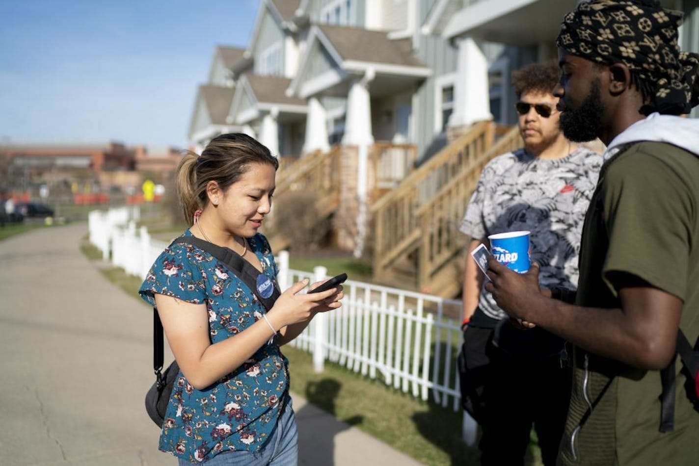 Nelsie Yang, who is running for St. Paul City Council's Ward 6 district, took Izell Scales' number while connecting with people and door knocking in Northeast St. Paul, Minn., on Wednesday, April 24, 2019.