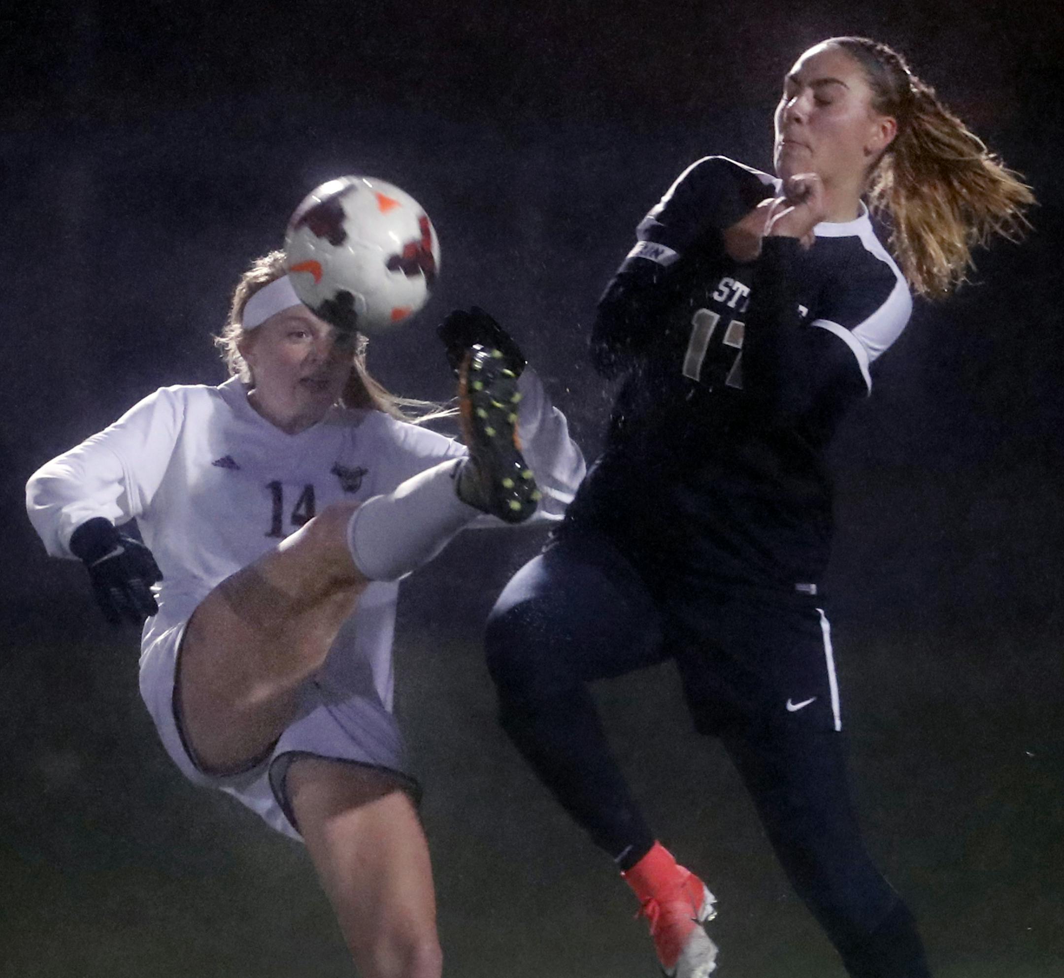 Meredith Haakenson(14) and Abby Sutton(17) of Eastview fight for the ball. ] Class 2A girls' soccer quarterfinals at Chisago Lakes.Maple Grove and Eastview clash. North,Richard Tsong-Taatarii/Richard.tsong-taatarii@startribune.com