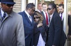 Prince's sister Tyka Nelson leaves the Carver County Justice Center in Chaska with her husband Maurice Philips.