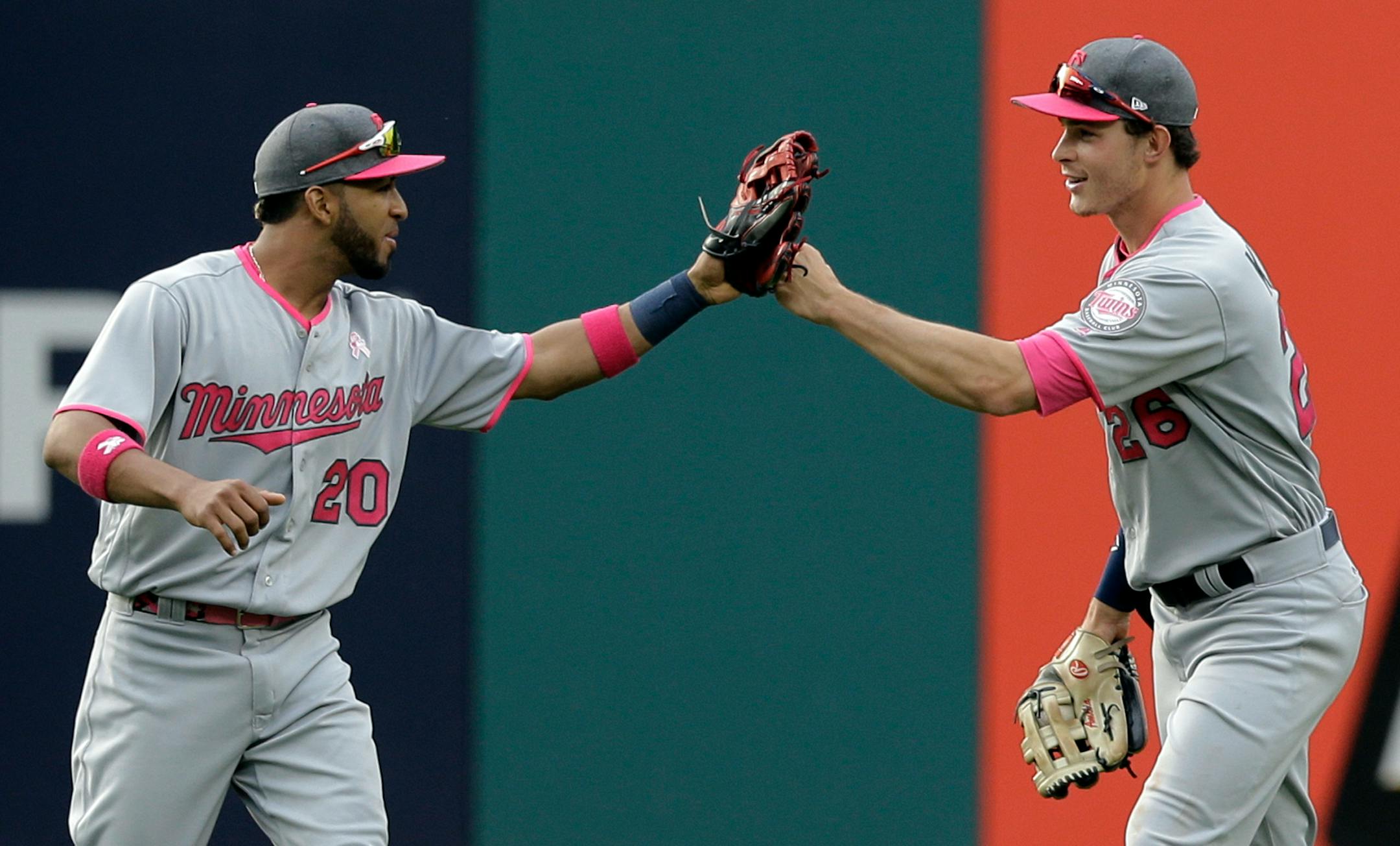 Minnesota Twins' Max Kepler, right, and Eddie Rosario celebrate after they defeated the Cleveland Indians in a baseball game, Saturday, May 13, 2017, in Cleveland.