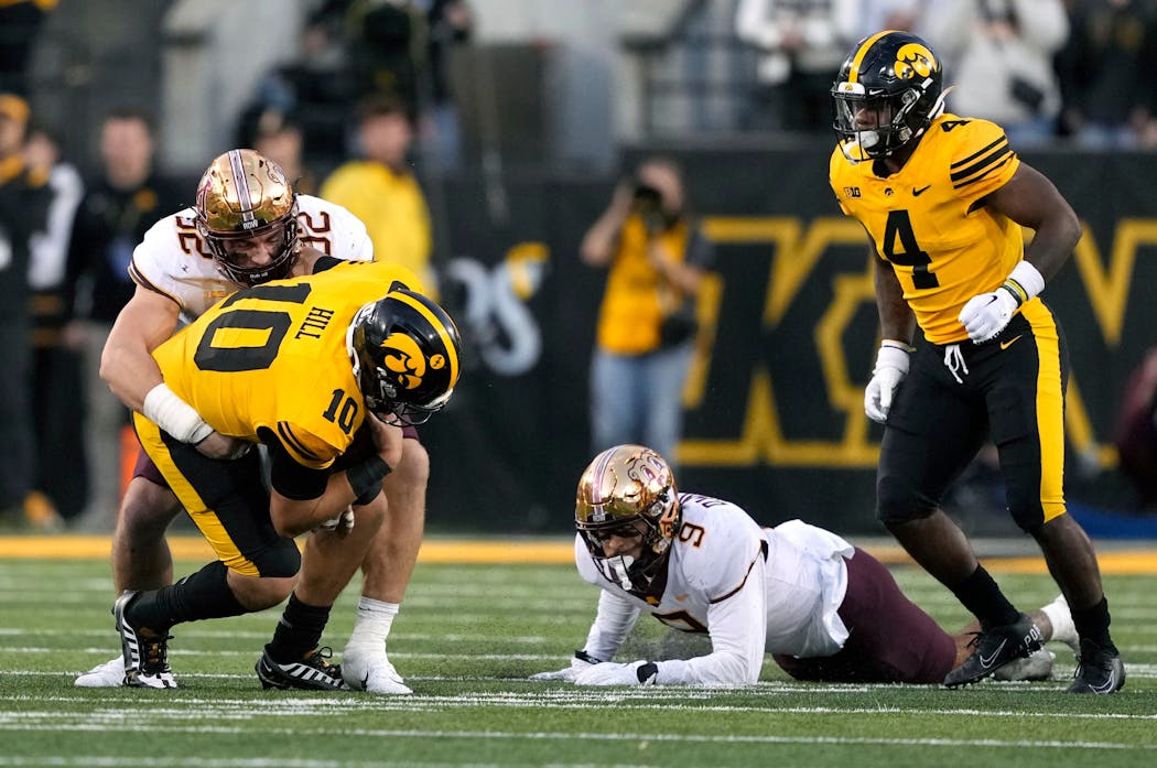 Gophers defensive lineman Danny Striggow sacked Iowa quarterback Deacon Hill near the end of Saturday’s game.