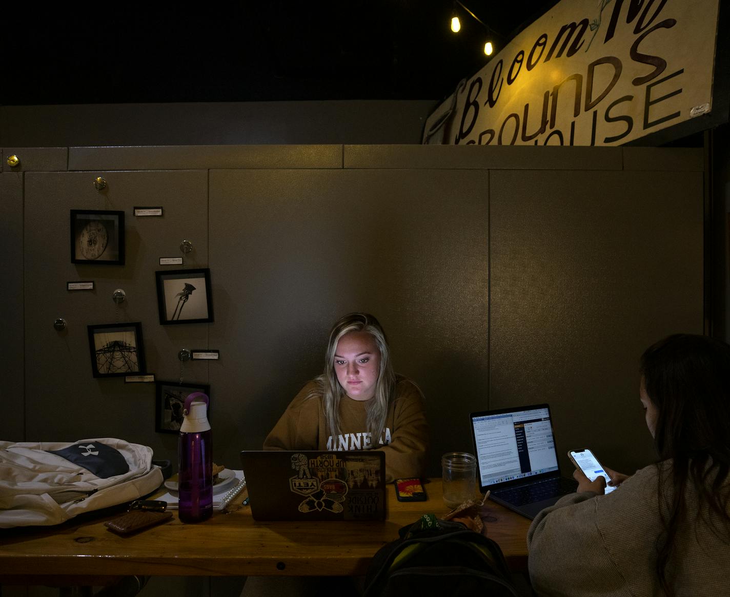 Sophie Scruggs, 19, and Cassidy Kabus, 20, both students at Winona State University worked on their laptops at Blooming Grounds Coffee House. ] CARLOS GONZALEZ • cgonzalez@startribune.com – Winona, MN, – September 24, 2020, A sense of normalcy has returned to college towns across Minnesota since the start of the fall semester, but with it has come increases in COVID-19 cases and greater risk to small communities like Winona,