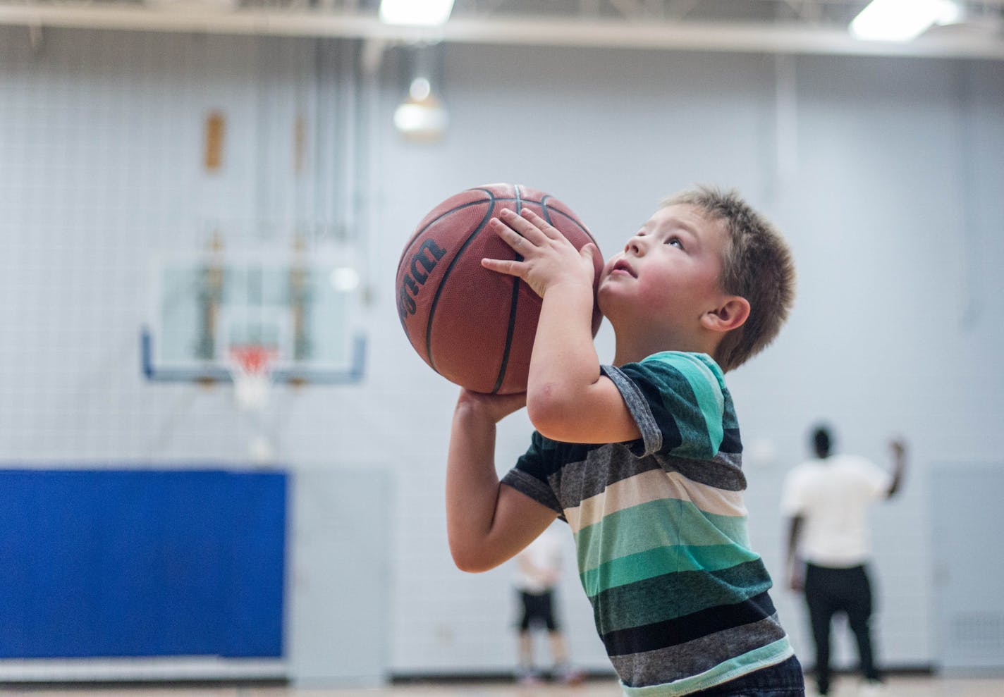 Carter Aranda sets up to thow a basketball Saturday afternoon. Elizabeth Brumley special to the Star Tribune * The revamped Palace Recreation Center officially openened Saturday.