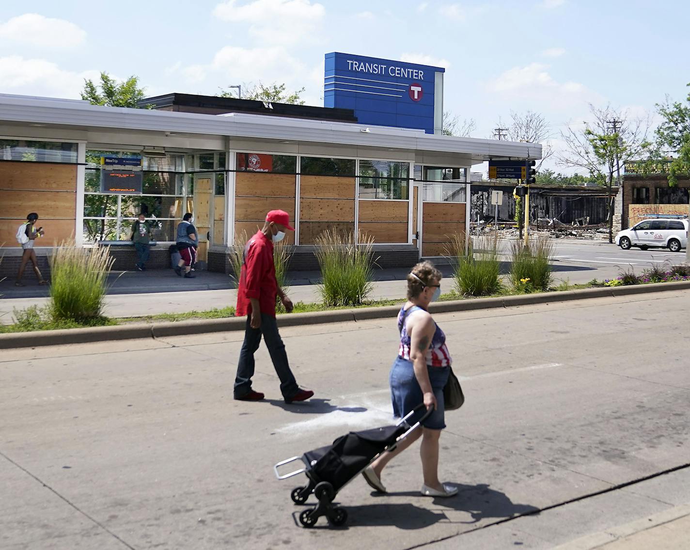 Windows broken out and boarded up following the killing of George Floyd and the unrest that ensued at the Transit Center on Chicago Avenue near Lake St. as commuters walk by Thursday in Minneapolis.] DAVID JOLES • david.joles@startribune.com Improvements to bus service along the Twin Cities' busiest transit corridors have stalled as lawmakers try to sort out a bonding bill at the Capitol. The proposed B and D rapid bus projects also travel along areas struggling to recover following the unrest r