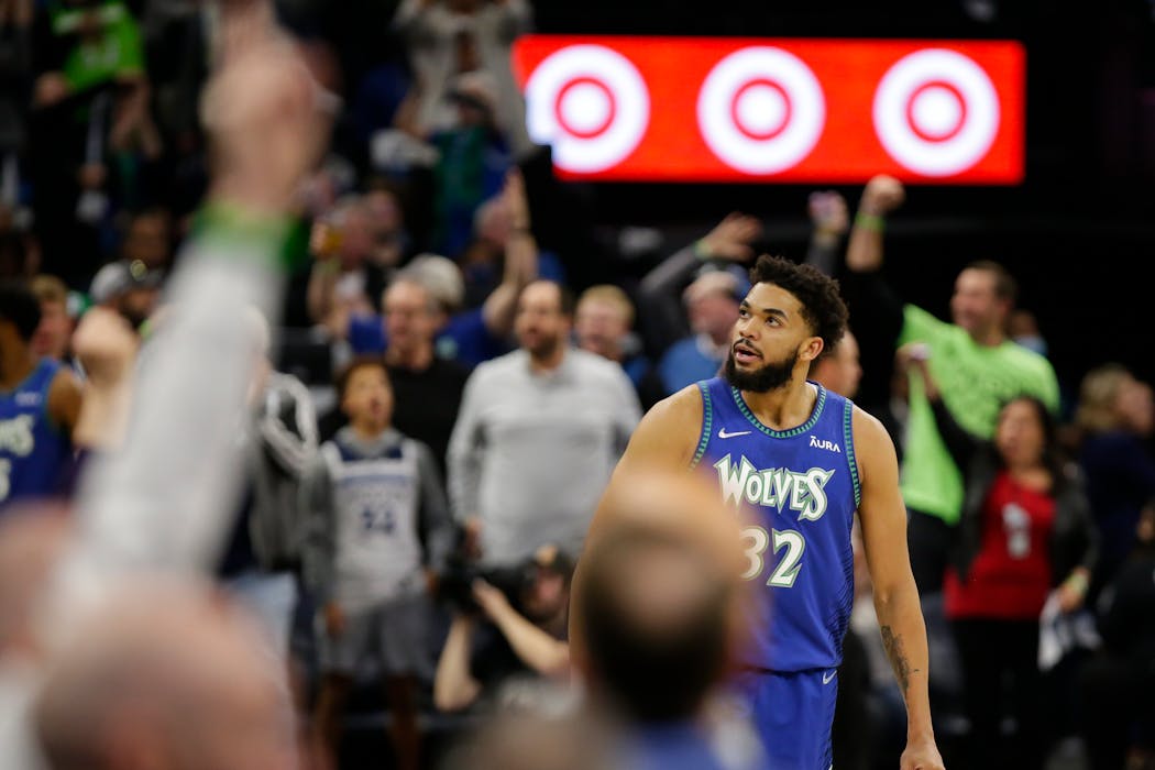 Minnesota Timberwolves center Karl-Anthony Towns looked at cheering fans during a playoff game in April. 