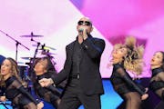 Pitbull performed with visual and video accompaniment at the Las Vegas stop on his fall tour with Enrique Iglesias/ AP Photo/Las Vegas News Bureau, Gl