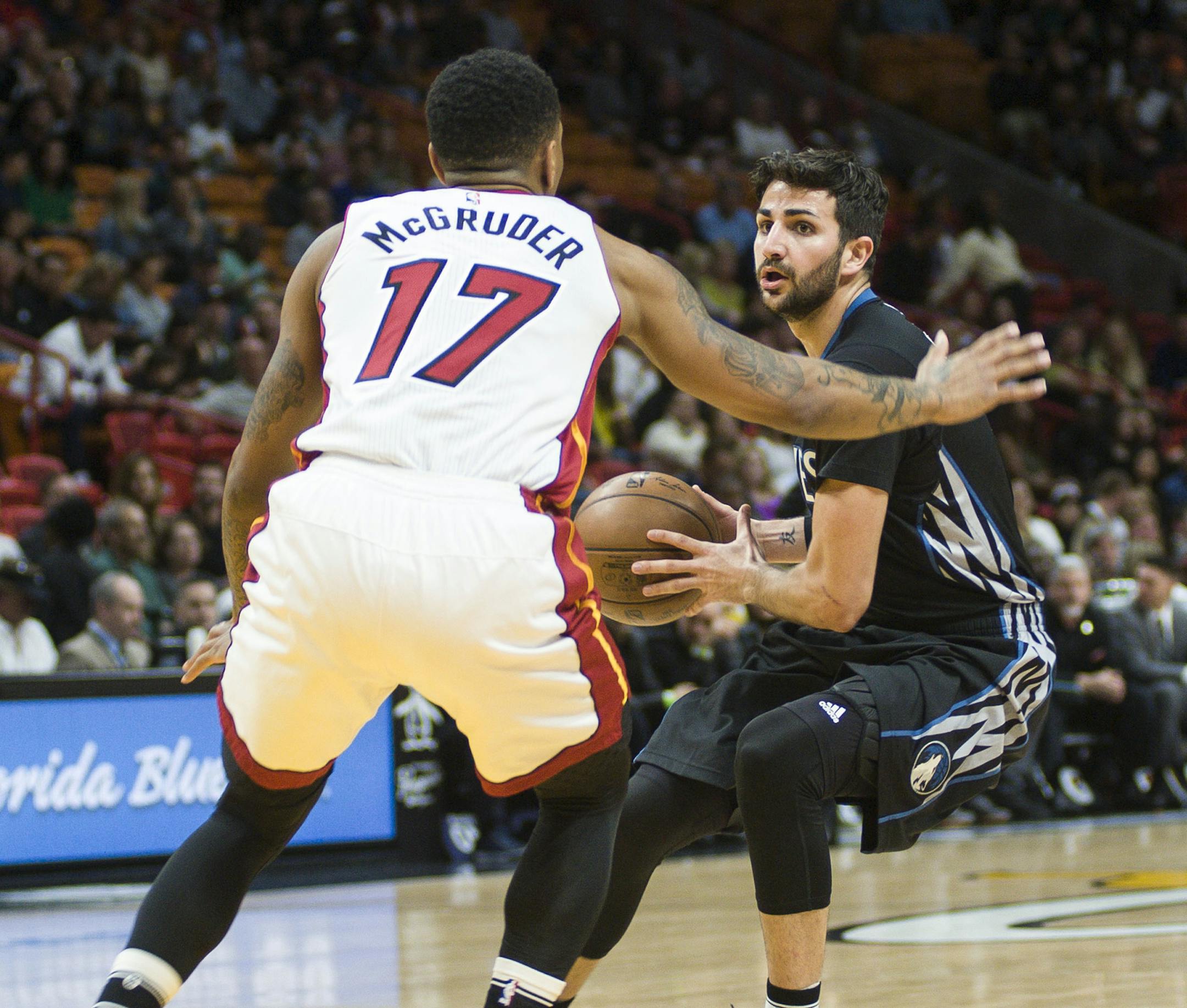 Minnesota Timberwolves' Ricky Rubio (9) attempts to get by Miami Heat Rodney McGruder (17) during the second quarter of an NBA basketball game Friday, Mar. 17, 2017, in Miami. (AP Photo/Gaston De Cardenas)