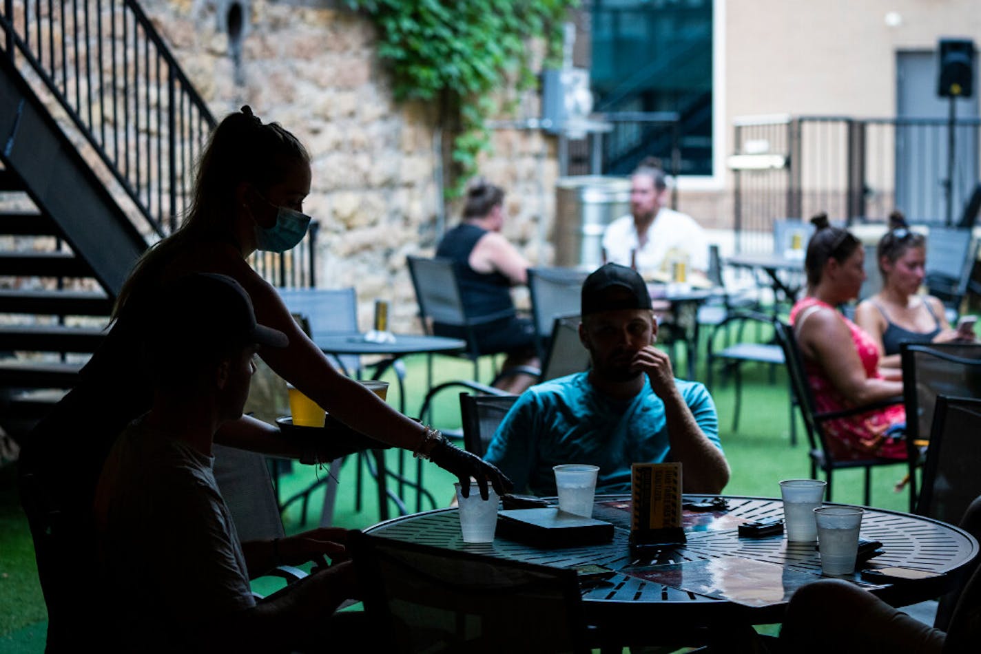 Patrons carefully practice socially distancing at the 507 in Mankato in July.