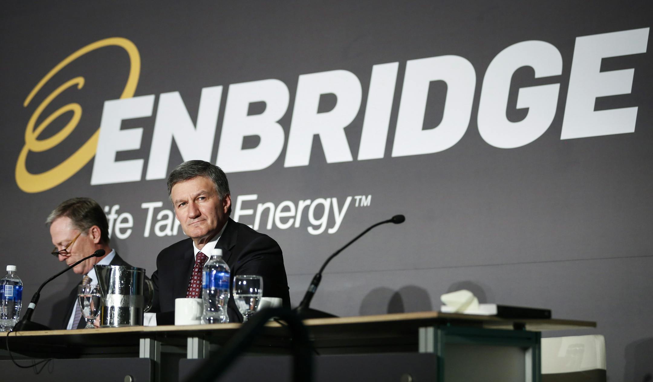 Enbridge Inc. president and CEO Al Monaco, right, shown in May 2017, said the company will continue to pursue its preferred route for a pipeline across northern Minnesota. (Jeff McIntosh/The Canadian Press via AP)