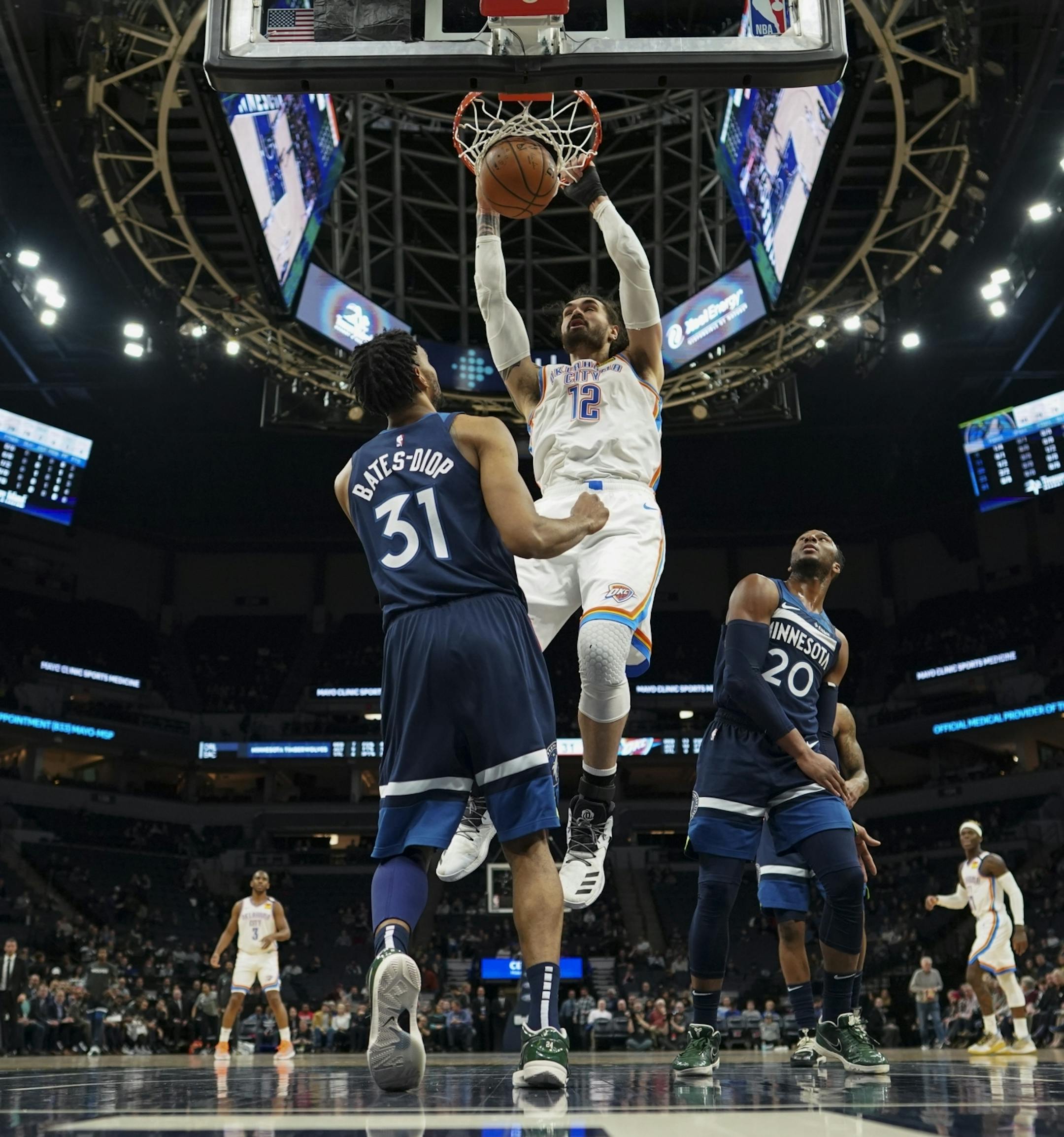 Oklahoma City Thunder center Steven Adams (12) dunked in the first half over Minnesota Timberwolves forward Keita Bates-Diop (31). He finished with 13 points.