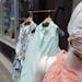 A mannequin displays a mask in front of a boutique clothing store, Thursday, July 9, 2020, in Boston. (AP Photo/Steven Senne)