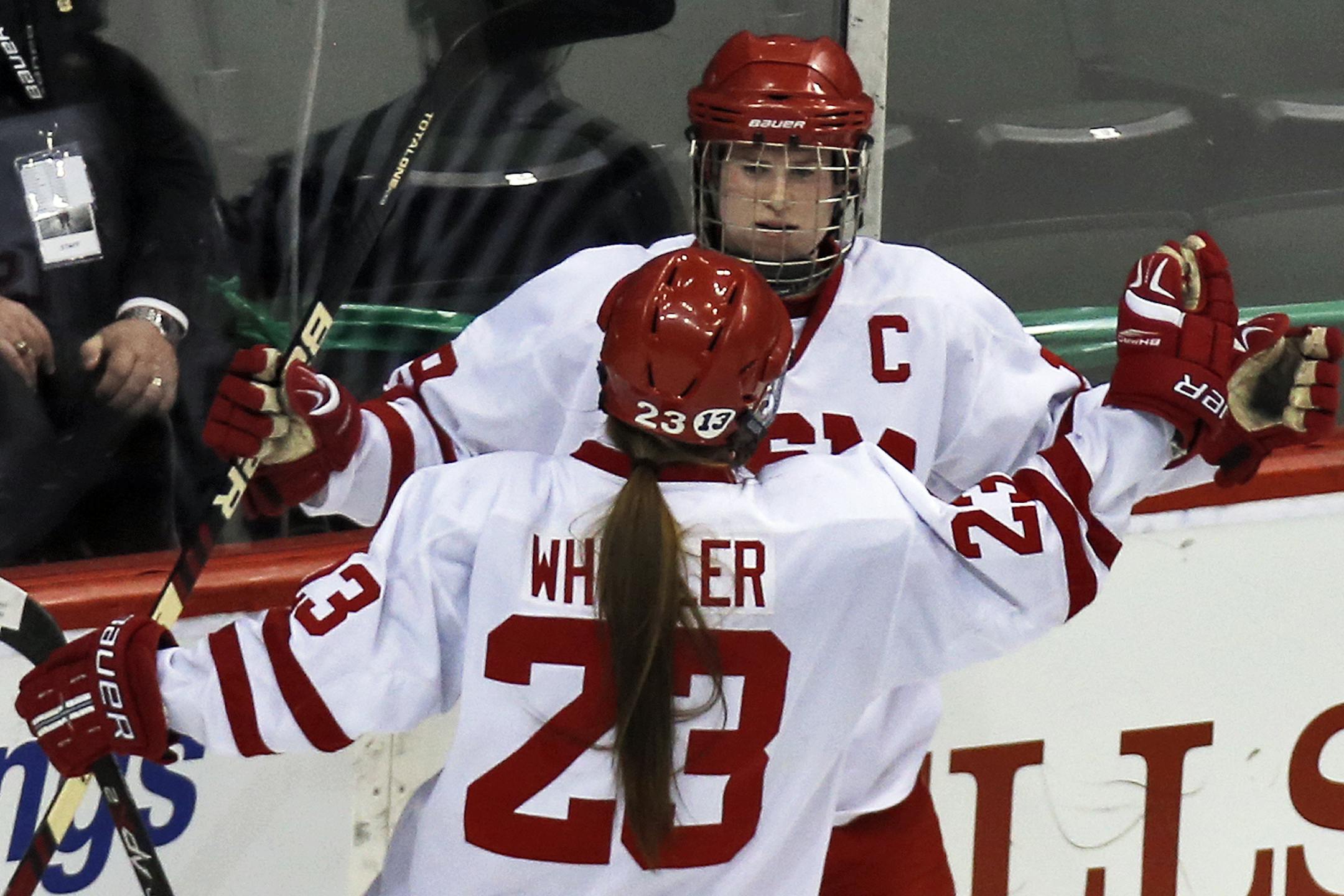 Girls State Hockey Tournament - Class 2A - Roseau Rams vs. Benilde-St. Margaret's Red Knights. Red Knights Brittany Wheeler (23) congratulated teammate Kelly Pannek after Pannek scored the first of two goals in the 2nd period. (MARLIN LEVISON/STARTRIBUNE(mlevison@startribune.com)