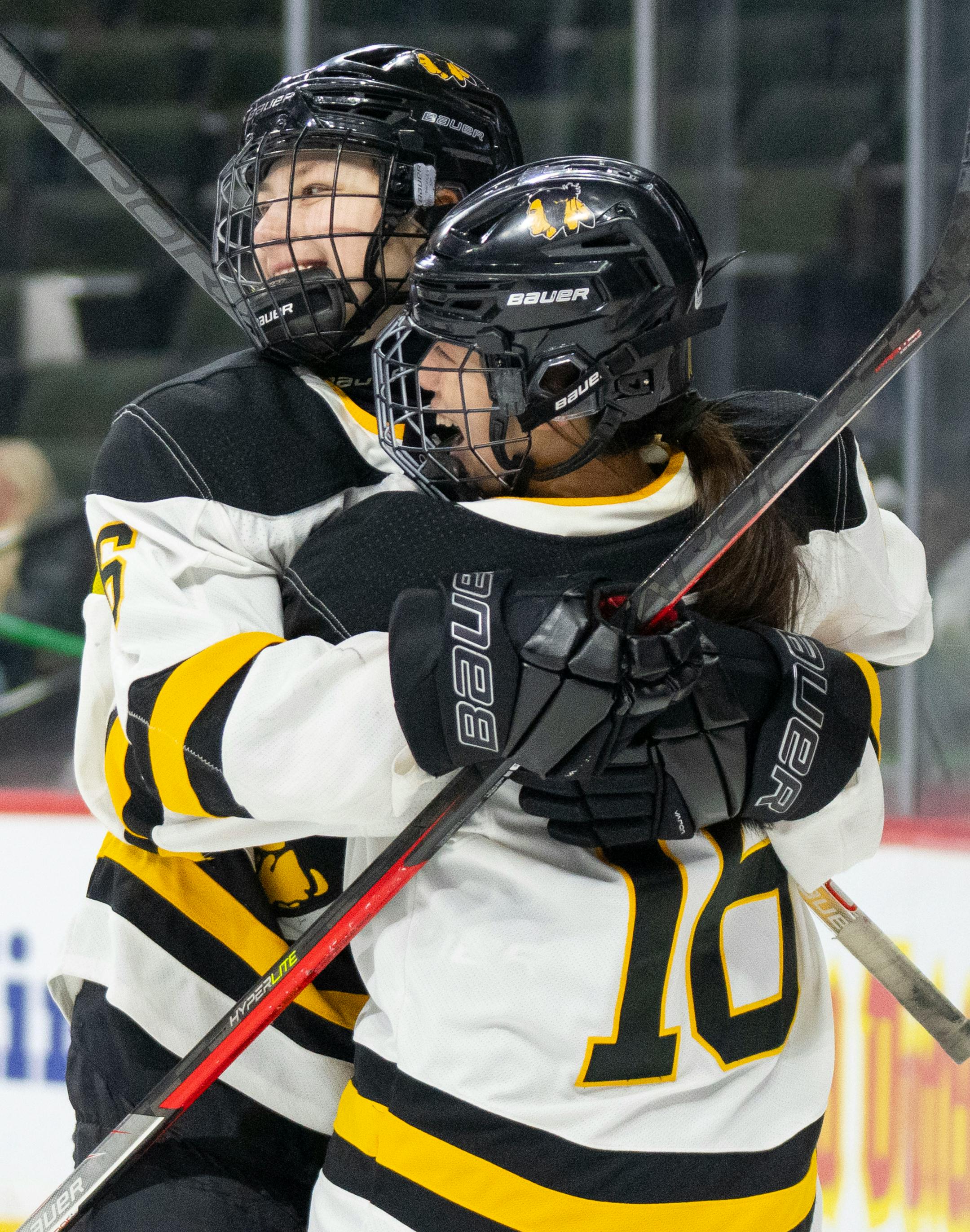 Warroad forward Rylee Bartz (6) is embraced by forward Kate Johnson (16) after scoring a goal in the first period.