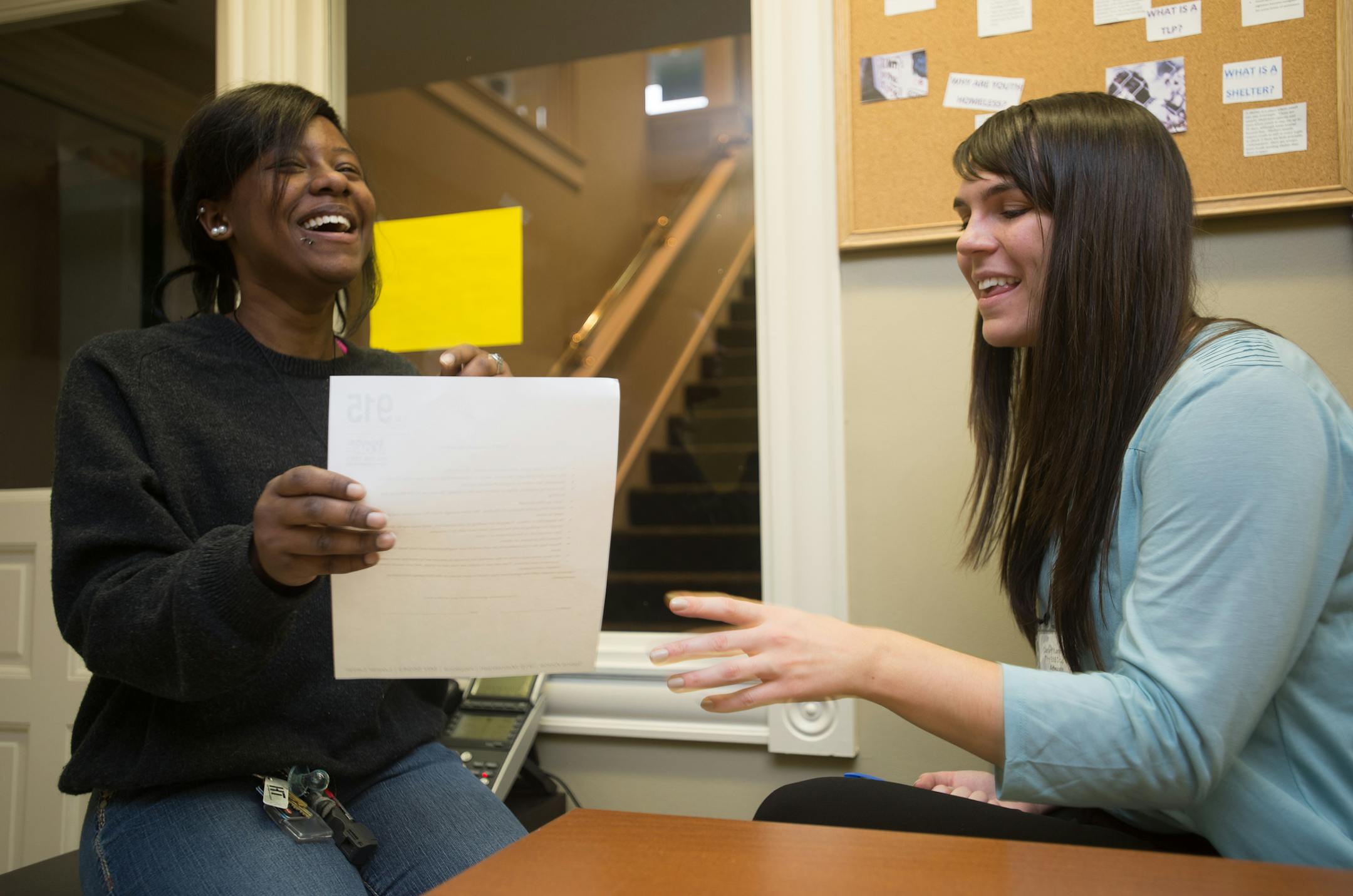 Shae Hall (cq), left, member of The 915 advisory board, and Carley Kammerer (cq), 915 drop-in advocate, joke around before the start of The 915's grand opening on Thursday. ] AARON LAVINSKY • aaron.lavinsky@startribune.com Teens Alone, an organization which serves homeless teens in the West Metro, held its grand opening of The 915, a drop-in center on Mainstreet, Thursday, October 30, 2014 in Hopkins. Shae Hall (cq) was sleeping on other peoples' couches during her senior year in high sch