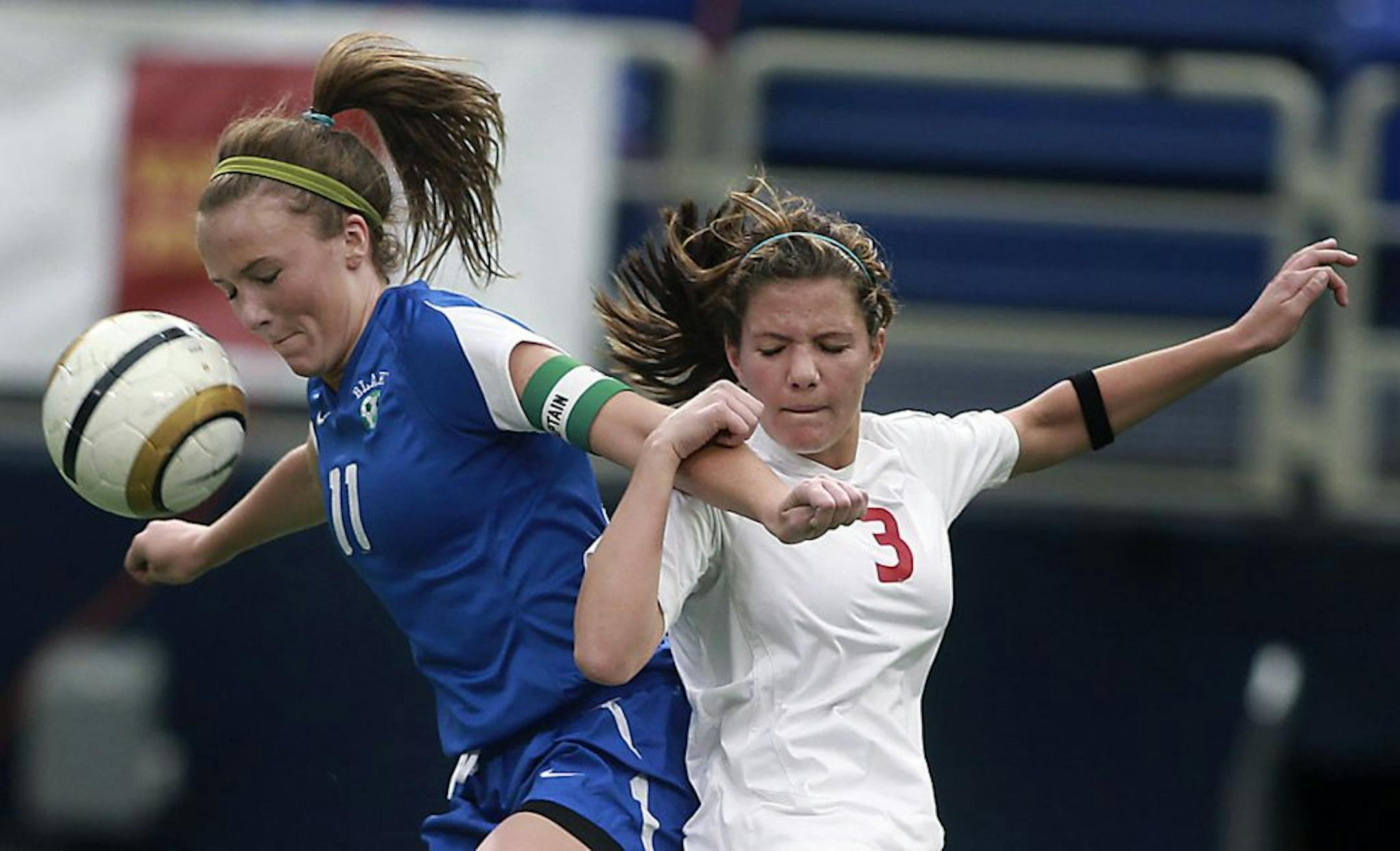 Blake's Meghan Bauer, left, and Benilde-St. Margaret's Katie Oppenheimer struggled for posession of the ball during the second half of the Class 1A girls' soccer championship game at the Metrodome on Thursday. The Bears held on for a 1-0 victory.