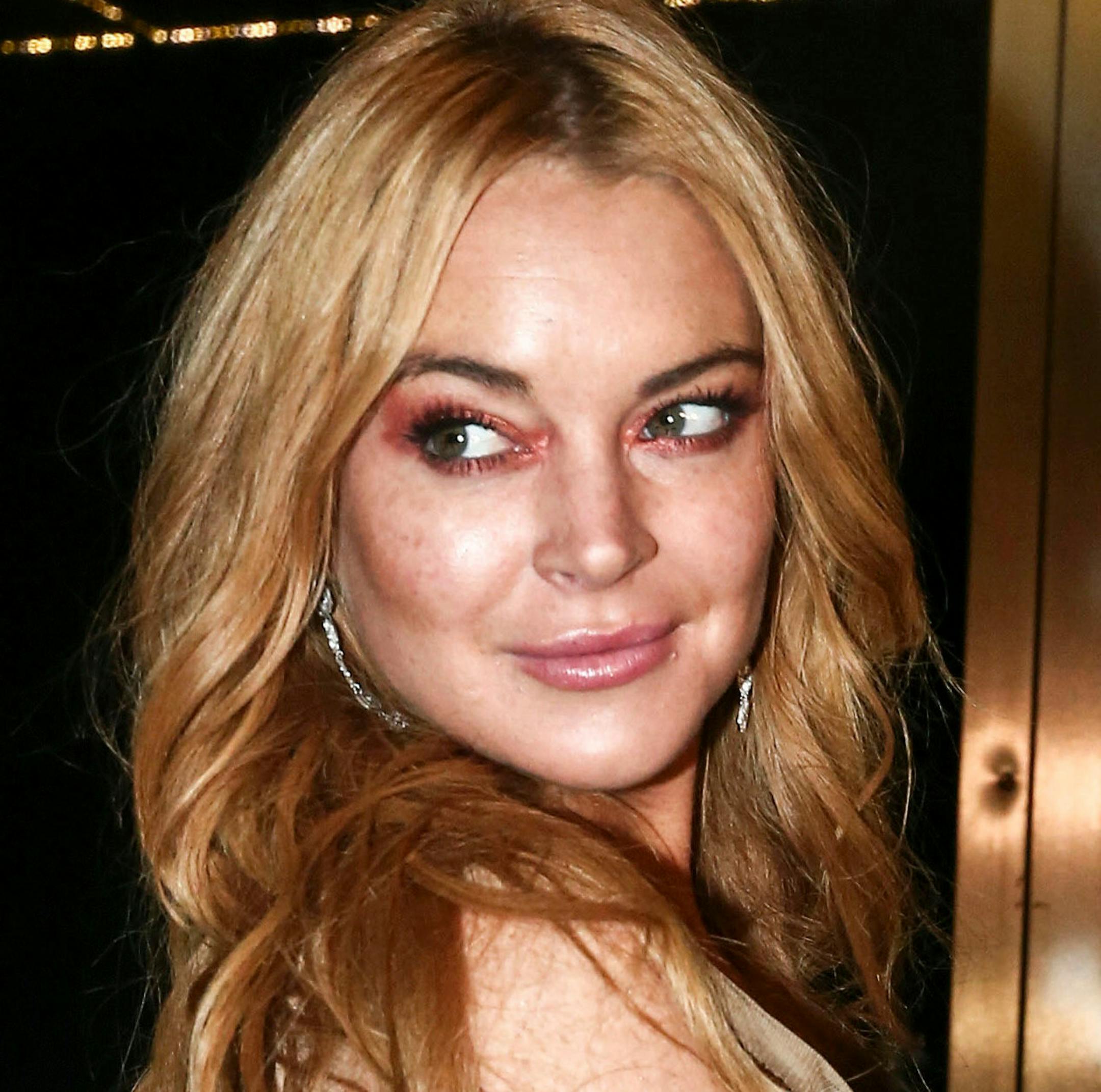 FILE - In this Oct. 16, 2016, file photo, actress Lindsay Lohan appears at the opening night of the Lohan Nightclub in Athens, Greece. Lohan sued a software company for using what she claims is a likeness of her in a video game. The New York Court of Appeals ruled Thursday, March 29, 2018, that the satirical representations of "a modern, beach-going" young woman are not identifiable as Lohan. The court affirmed a ruling from a lower state appeals court dismissing her lawsuit. (AP Photo/Yorgos Ka