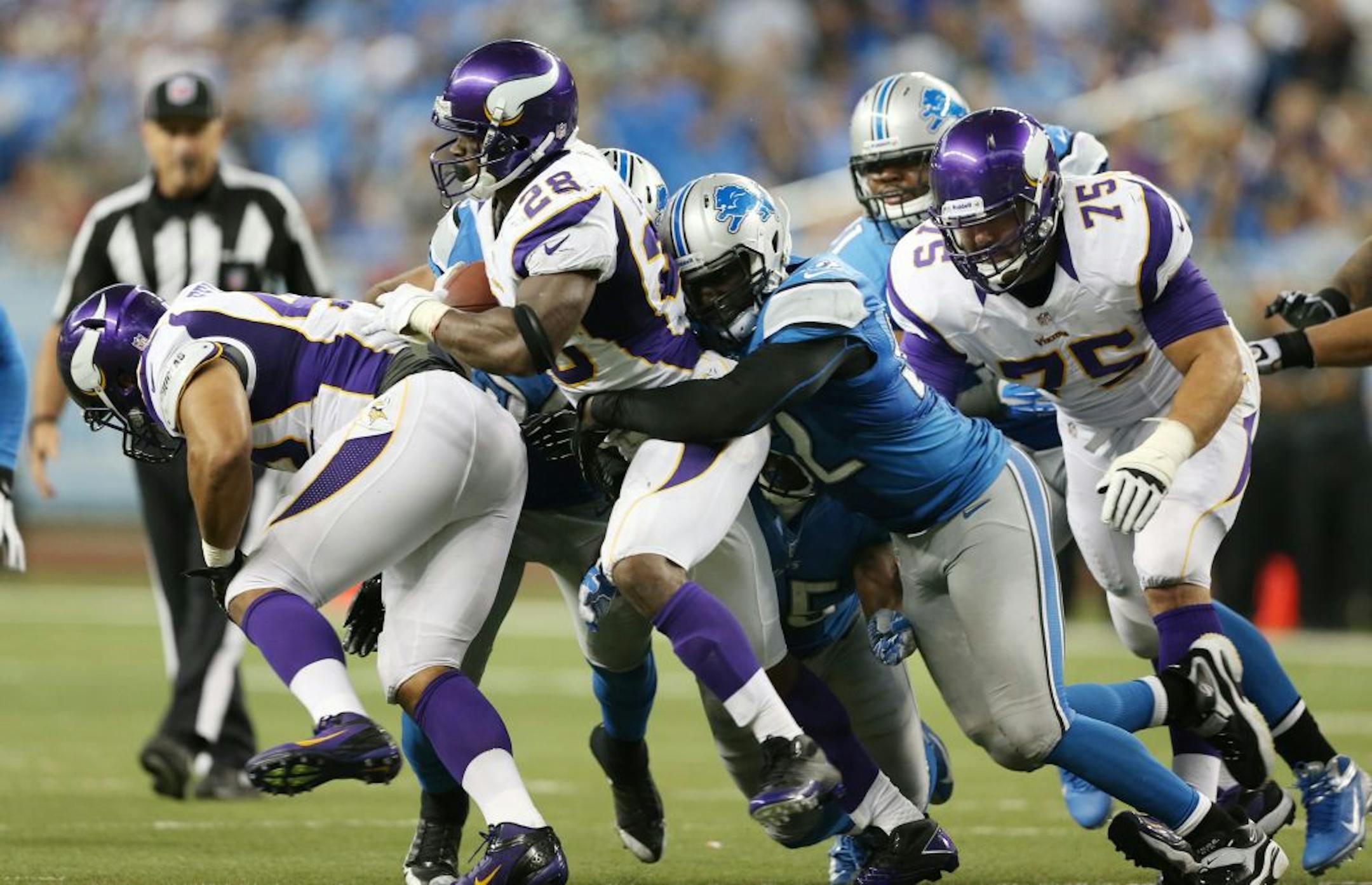 Adrian Peterson finished with 102 yards rushing and a 4.9-yard average with the help of the Vikings offensive line.