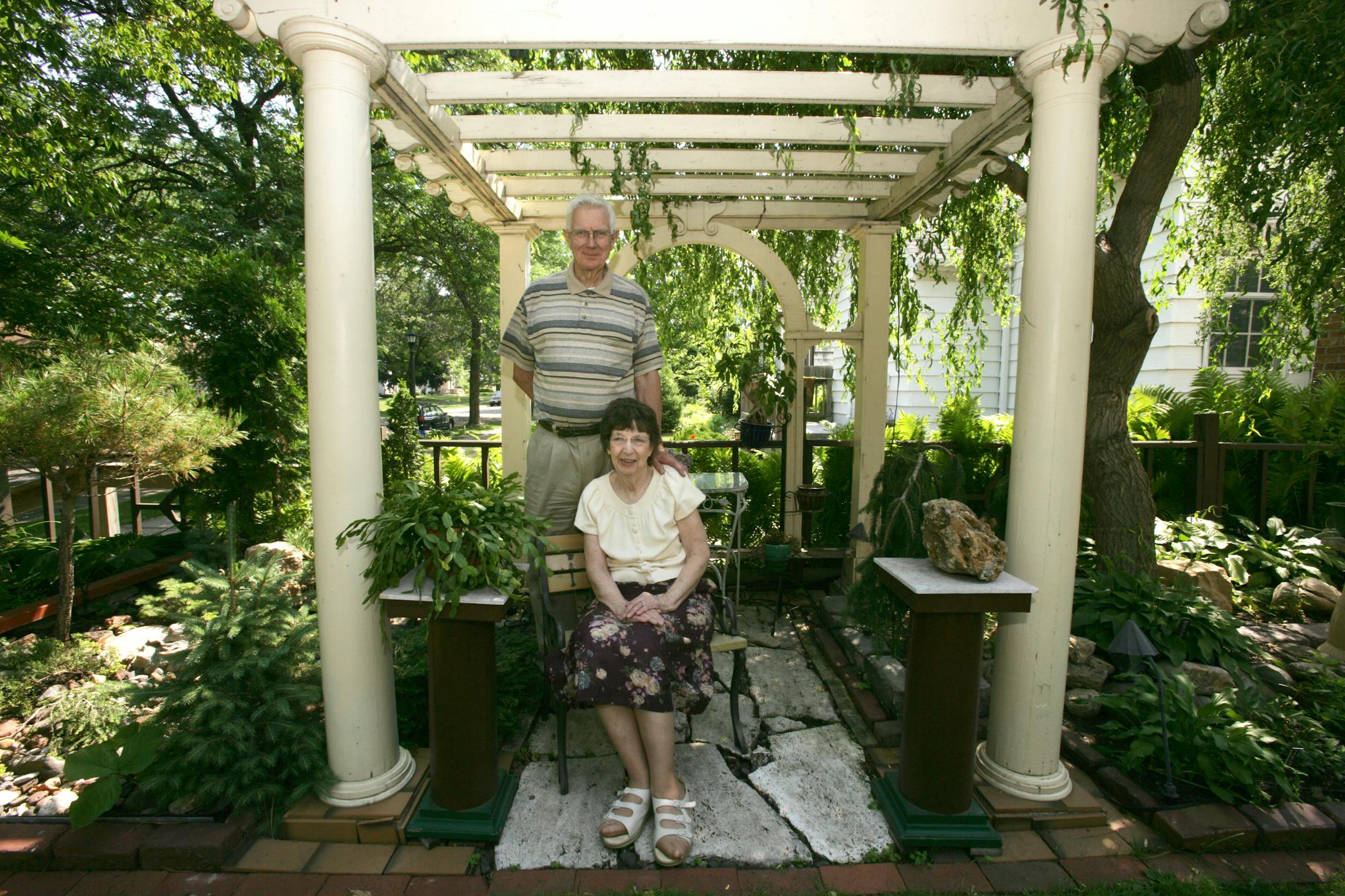 Lee Hallgren has been a fearless front-yard gardener for more than 40 years, adding trees, flowers and salvaged structures to the once empty space. His wife, Rose, is his "artistic director."