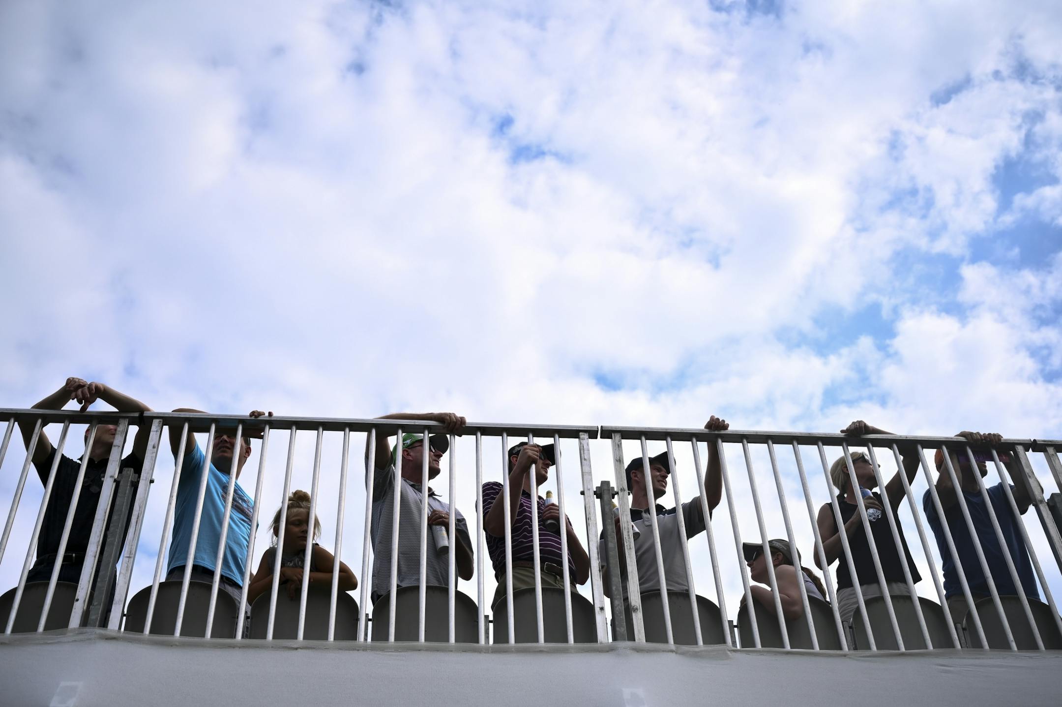 Fans watched as golfers teed off on the eighteenth hole Saturday.