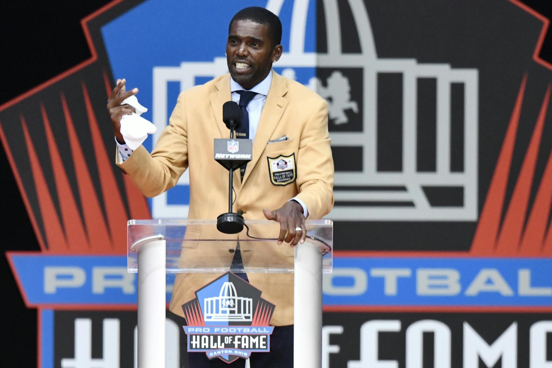 Former NFL wide receiver Randy Moss delivers his induction speech at the Pro Football Hall of Fame on Saturday, Aug. 4, 2018, in Canton, Ohio.