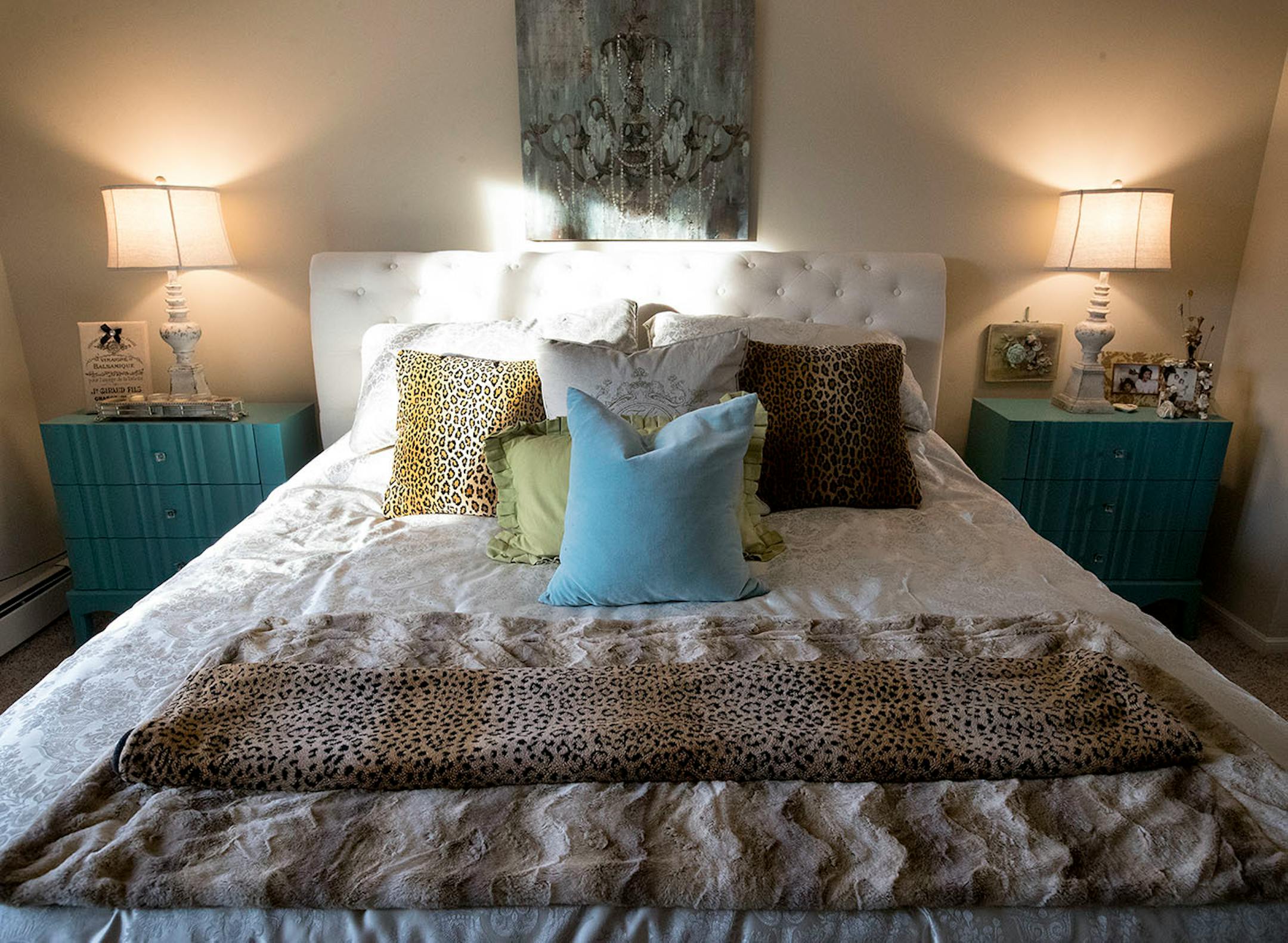 A furry throw and accent pillows dress up the bed.